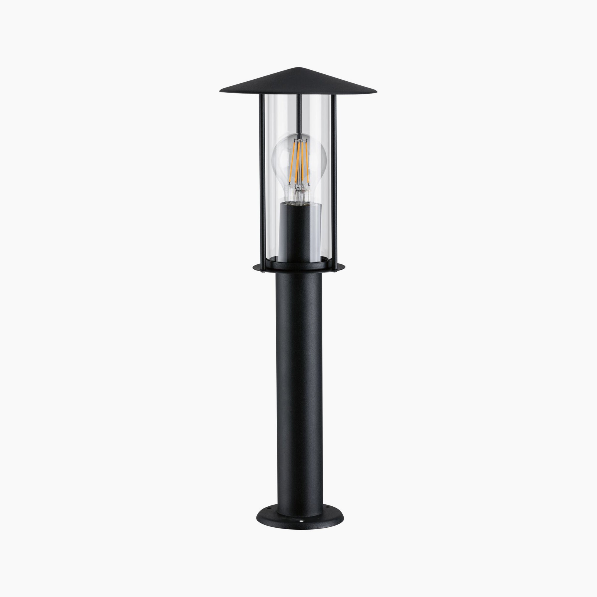 The Paulmann Outdoor Classic 15W LED Bollard Light in Black features a clear glass casing and an exposed bulb, providing an insect-friendly glow that's perfect for your garden.