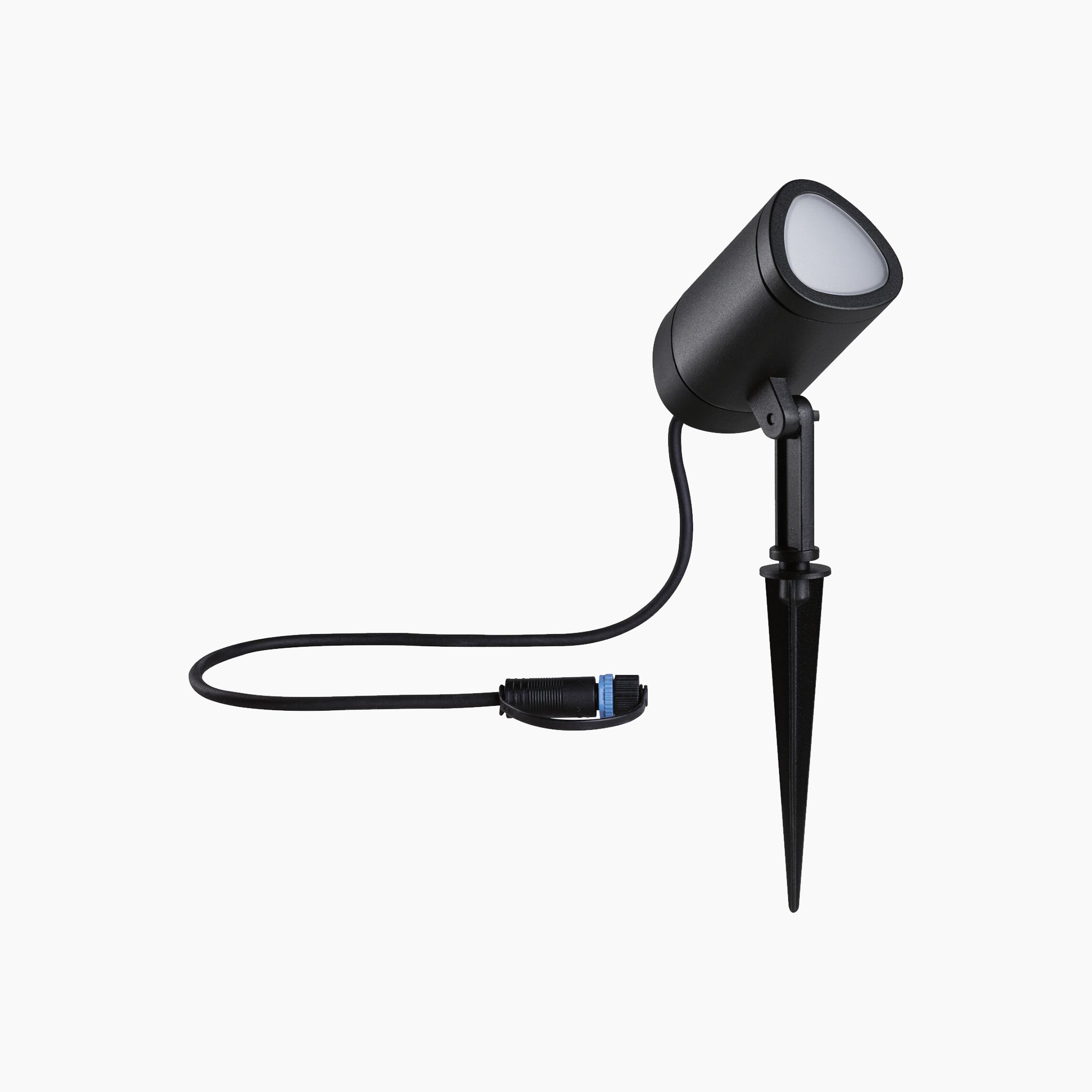 The Paulmann - Plug & Shine Outdoor 6.5W LED Garden Spotlight with Smart Home Zigbee 3.0 in Anthracite is a black spike light featuring a cylindrical head and an attached power cable, set against a white background. This weather-resistant spotlight offers RGBW color change capabilities, making it ideal for transforming your garden ambiance.