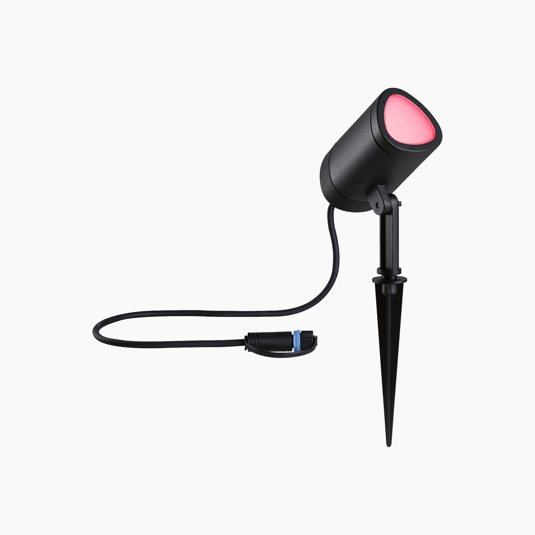 The anthracite-colored Paulmann Plug & Shine Outdoor 6.5W LED Garden Spotlight offers RGBW color change capabilities and is weather-resistant, casting a striking pink light. It includes a pointed stake for easy ground insertion, making it ideal for enhancing your garden ambiance with Zigbee 3.0 smart control.