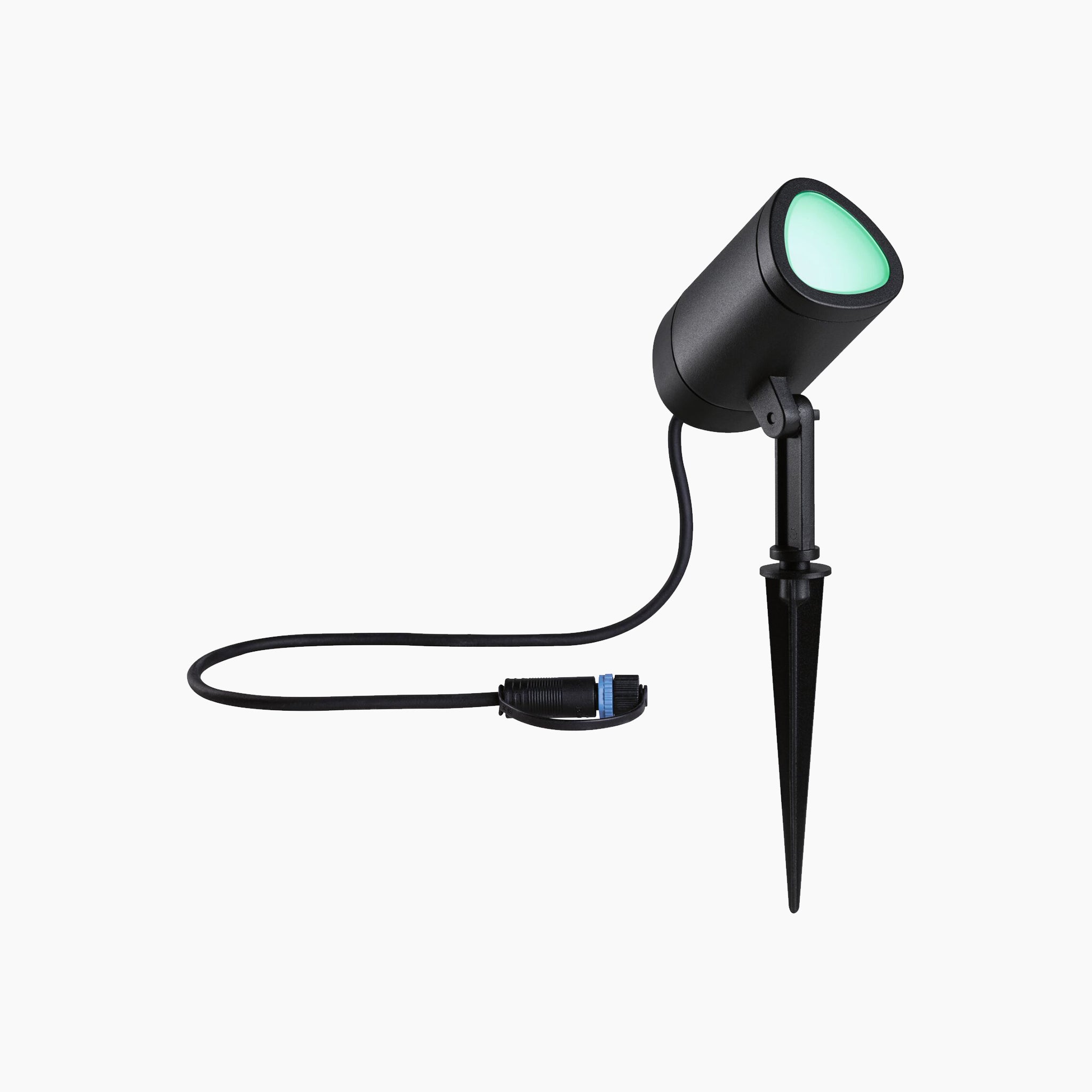 The Paulmann - Plug & Shine Outdoor 6.5W LED Garden Spotlight with Smart Home Zigbee 3.0 in Anthracite boasts a stylish design and offers dynamic lighting effects with RGBW color change technology. This weather-resistant spotlight provides vibrant green light, is mounted on a spike, and connected by cable for seamless integration into your garden.