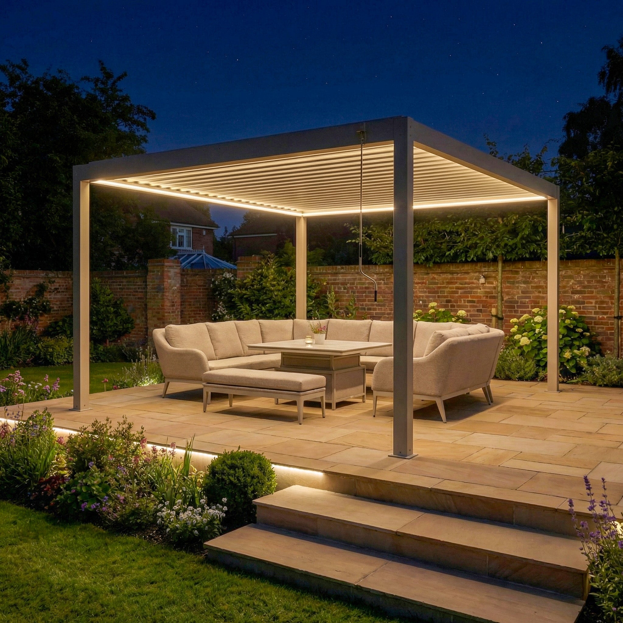 Contemporary patio featuring the PergoSTET Plus 4m x 4m Square Pergola with LED Lighting (Frame Only, Latte), beige sectional sofa, table, and nighttime garden—highlighting the modern elegance of this illuminated pergola.