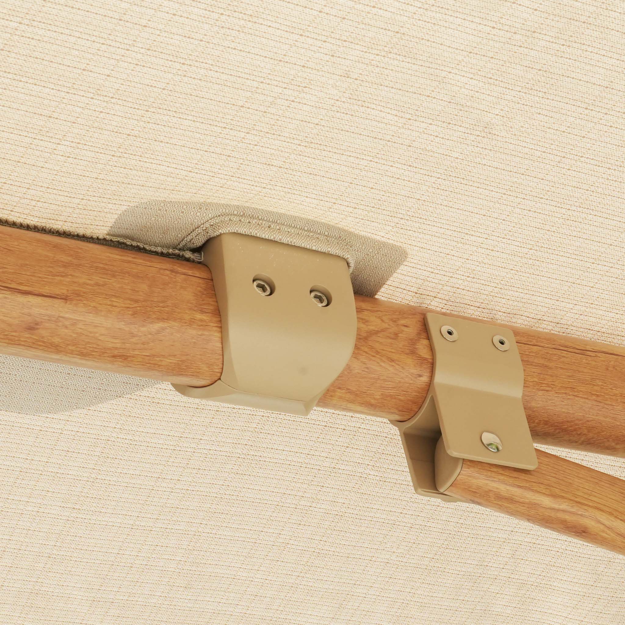 Close-up of durable olefin fabric attached to a wooden frame with beige metal brackets, showcasing sun protection features similar to a Finca 4m x 3m Cantilever Parasol in Sand.