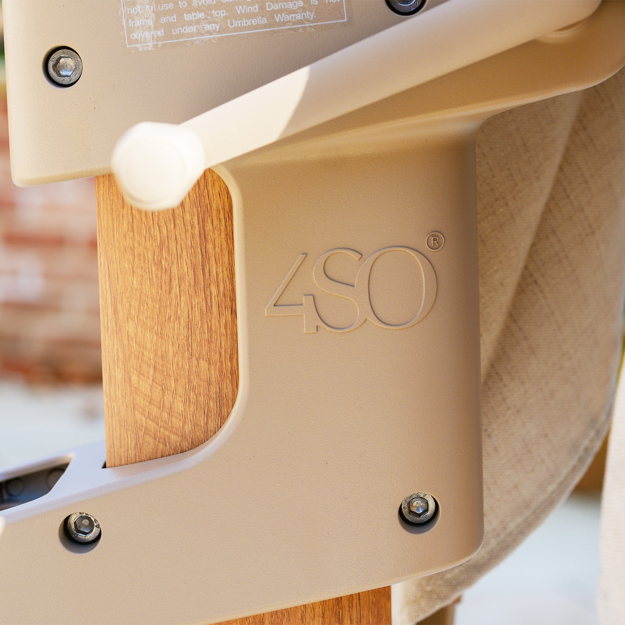 Close-up of the Finca 4m x 3m Cantilever Parasol in Sand with an engraved "4SO" logo, perfect for adding style and sun protection to your outdoor space.