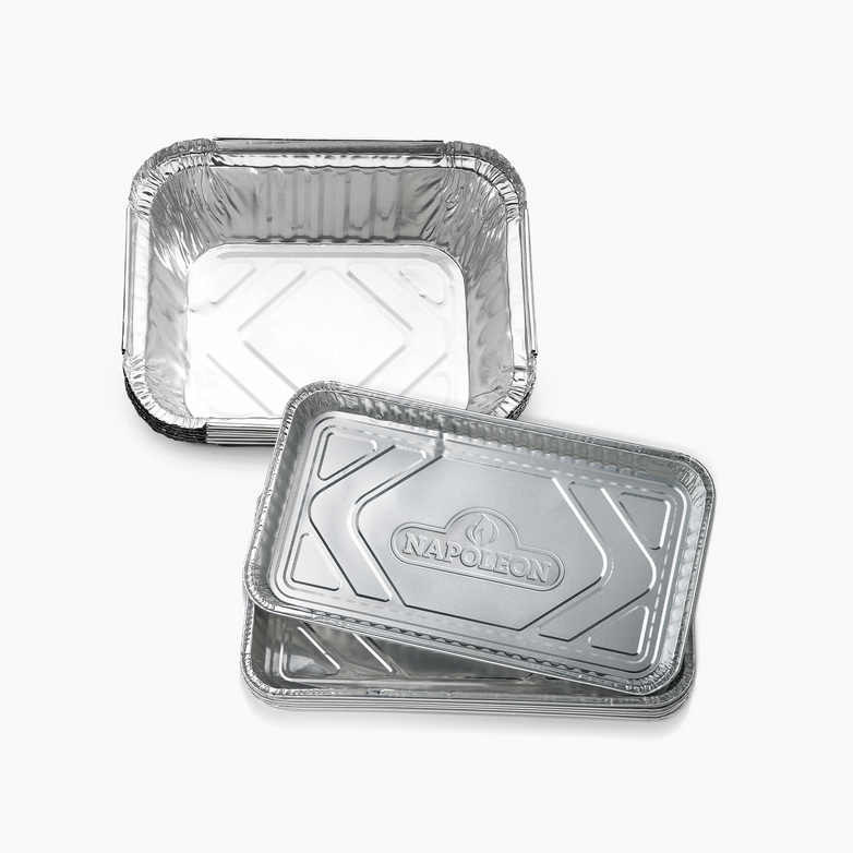 Two silver rectangular disposable aluminum Napoleon Drip Trays, one closed and one open, on a white background. Ideal for barbecue grill maintenance, these trays are perfect for catching drips and keeping your Napoleon Grill clean.