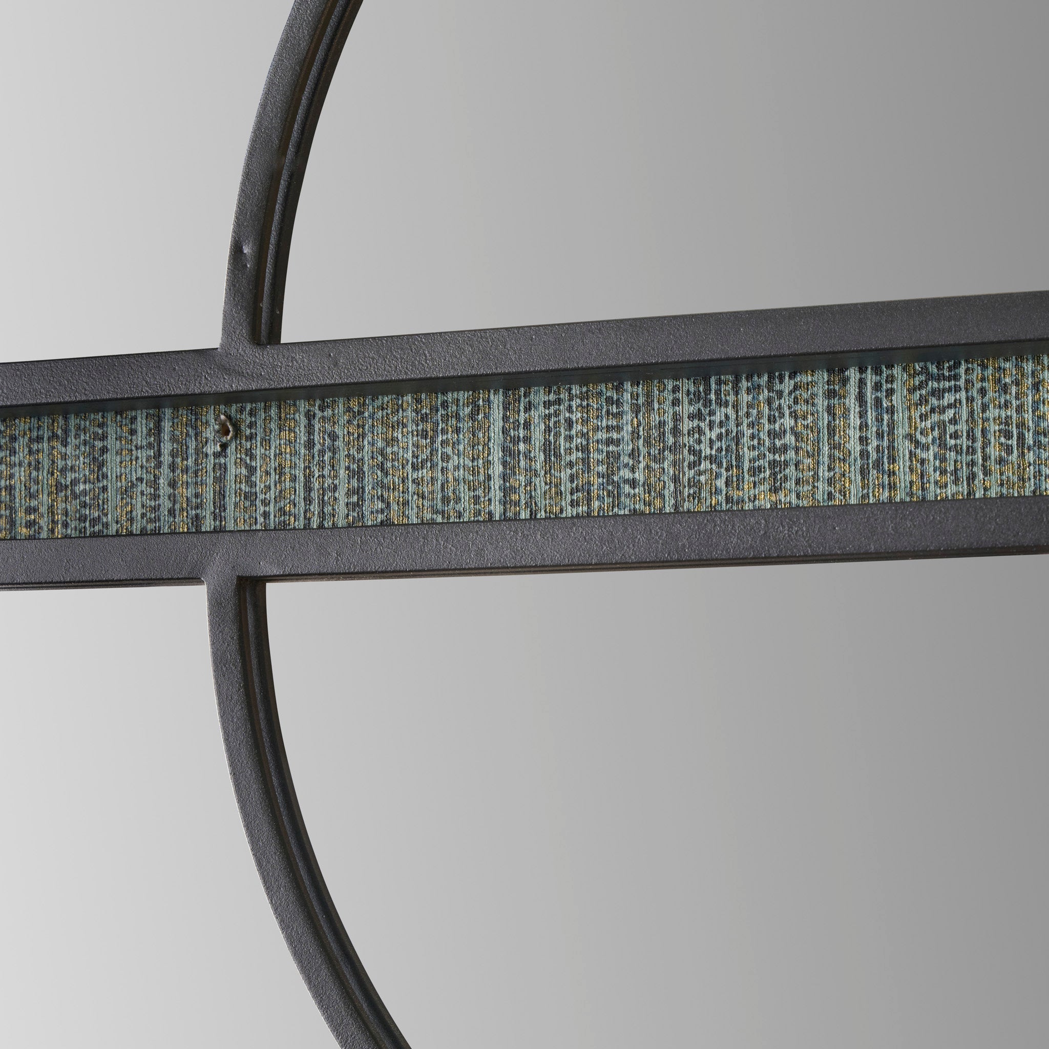 The Pacific Lifestyle Black Metal 2 Half Moon Section Wall Mirror is an elegant feature piece with a circular design. It showcases a textured horizontal metal bar in the center, and its dark metal frame adds depth and sophistication to any space.