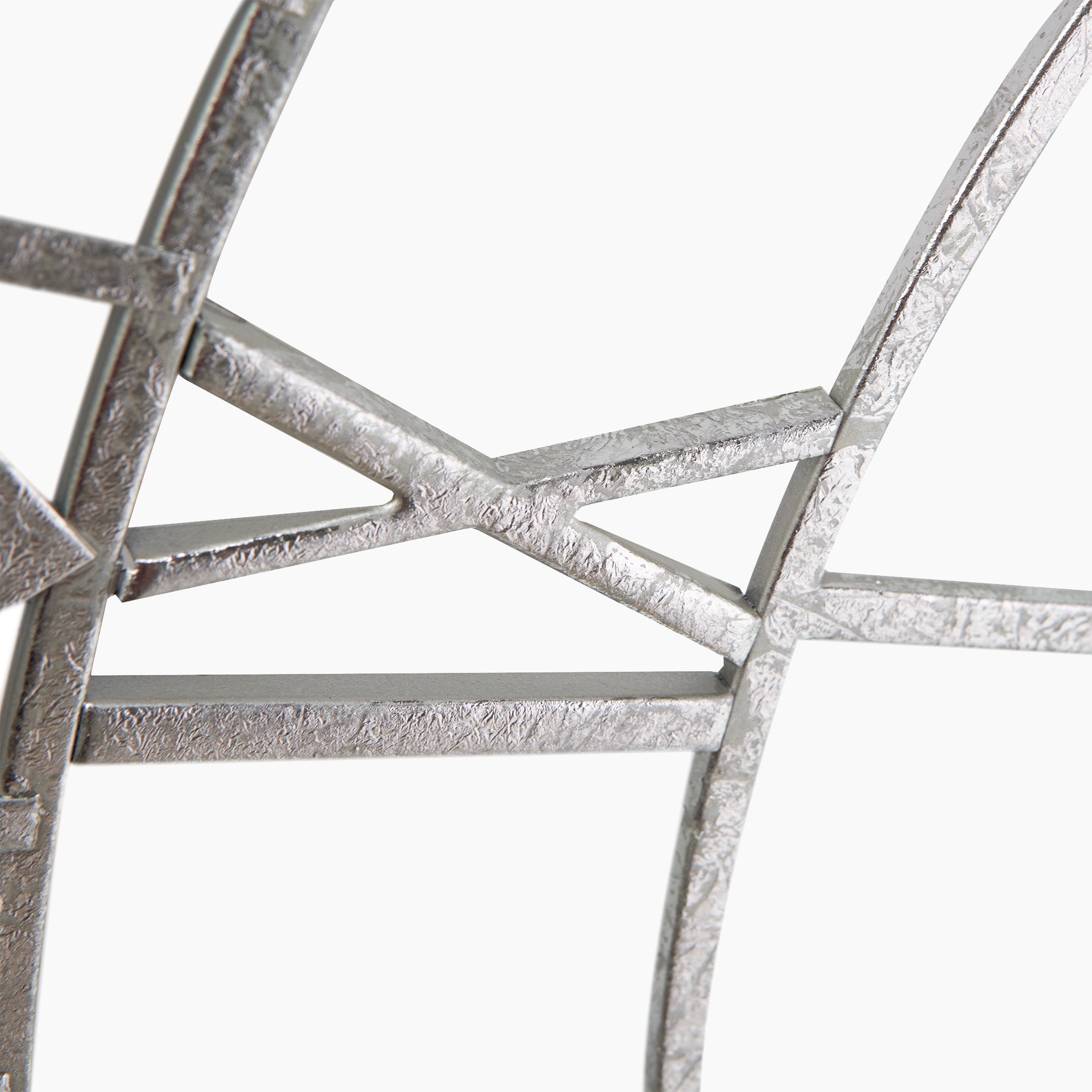 The Pacific Lifestyle - Antique Silver Metal Round Wall Clock Large showcases a detailed close-up of its lattice structure with intersecting silver bars and regal Roman numerals on a pristine white background.