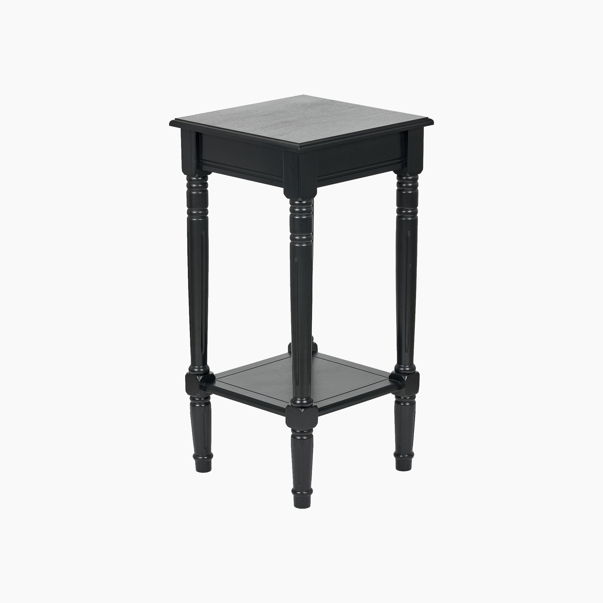 Check out the Pacific Lifestyle Heritage Black Pine Wood Accent Table—a black wooden side table with four turned legs and a lower shelf, radiating timeless elegance.