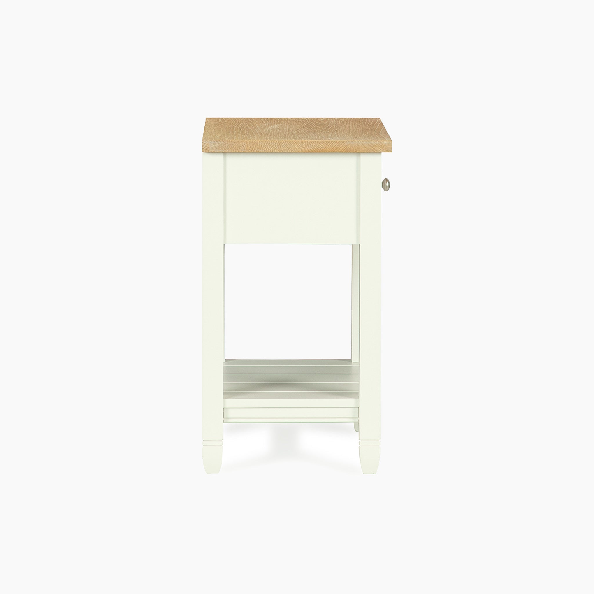 The Amberley Bedside Table in Warm White features a wooden top, lower shelf, and right-side drawer—ideal for modern country interiors.