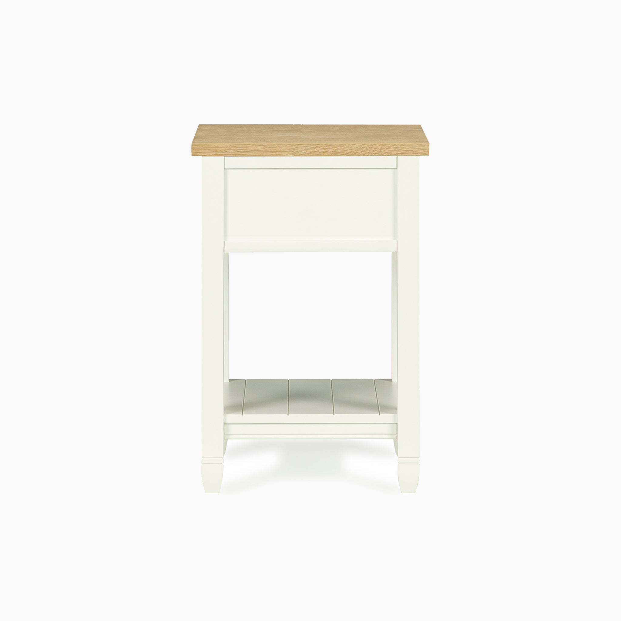 The Amberley Bedside Table in Warm White has a light wood top, one drawer, and an open shelf—ideal for modern country interiors.