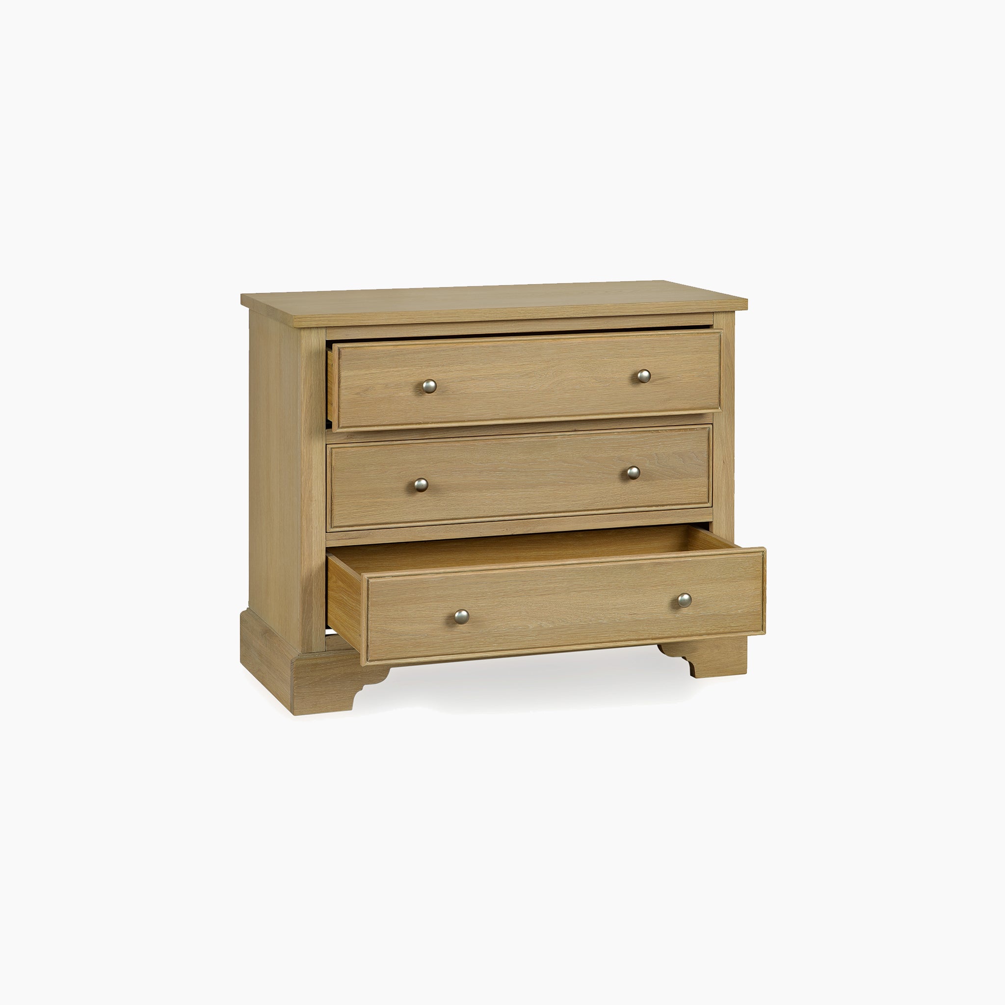 The Amberley 3 Chest of Drawers in Light Oak features three spacious drawers, with the bottom drawer partially open—perfect for bedroom storage furniture.