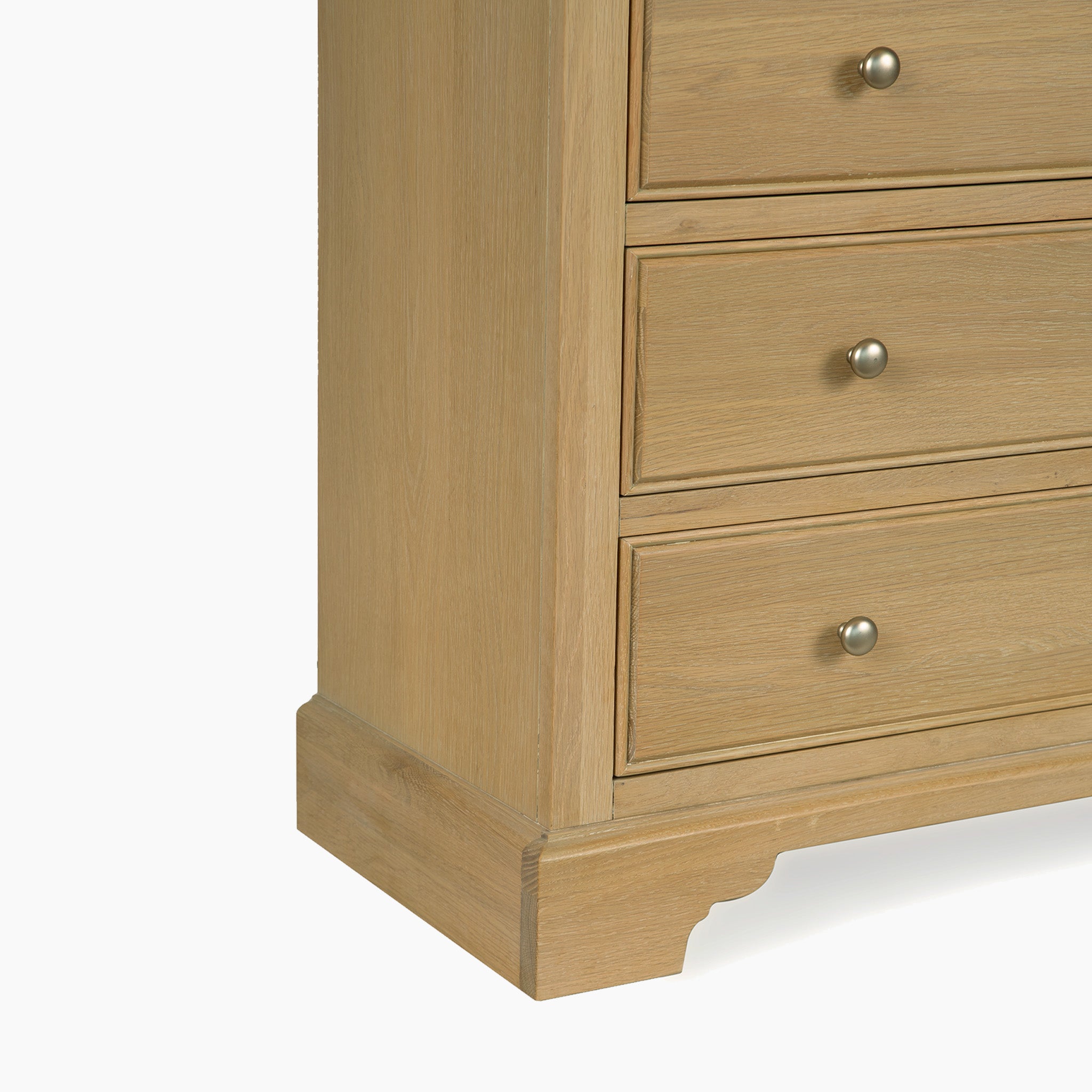 Amberley 3 Chest of Drawers in Light Oak features three spacious drawers with round metal knobs, shown from the side—a stylish bedroom storage solution.