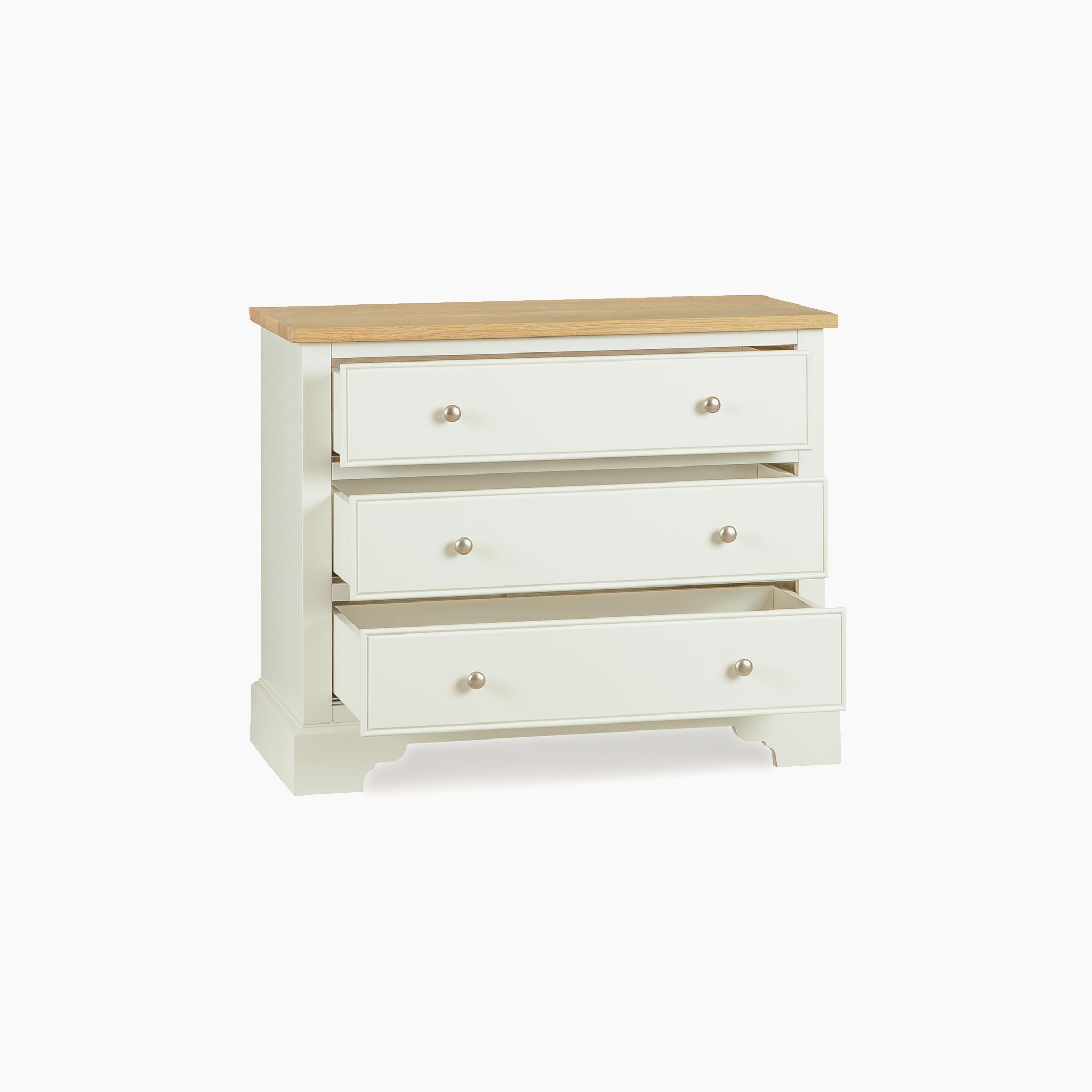 The Amberley 3 Chest of Drawers in Warm White features a wooden top and compact design, highlighting its elegant oak style with one drawer partly open against a white background.