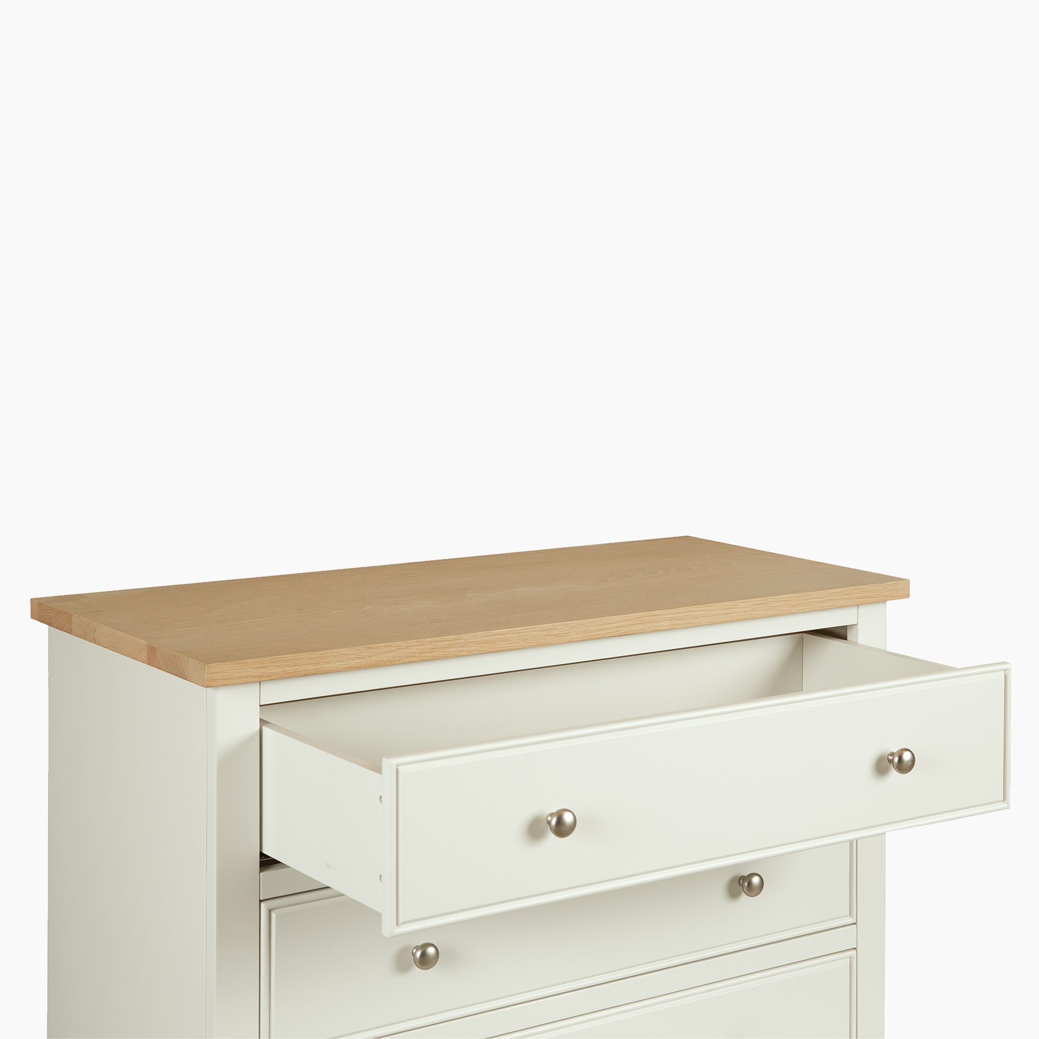 The Amberley 3 Chest of Drawers in Warm White offers stylish, compact bedroom storage with a light wood top and open top drawer, finished with metal knobs—a perfect elegant addition to any room.