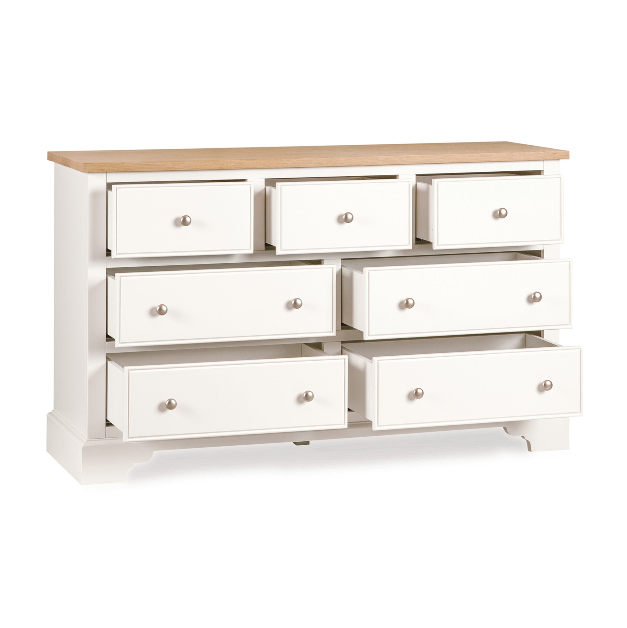 The Amberley 3 Over 4 Chest of Drawers in Warm White features an oak top and nine drawers, with three slightly open, shown against a white background.