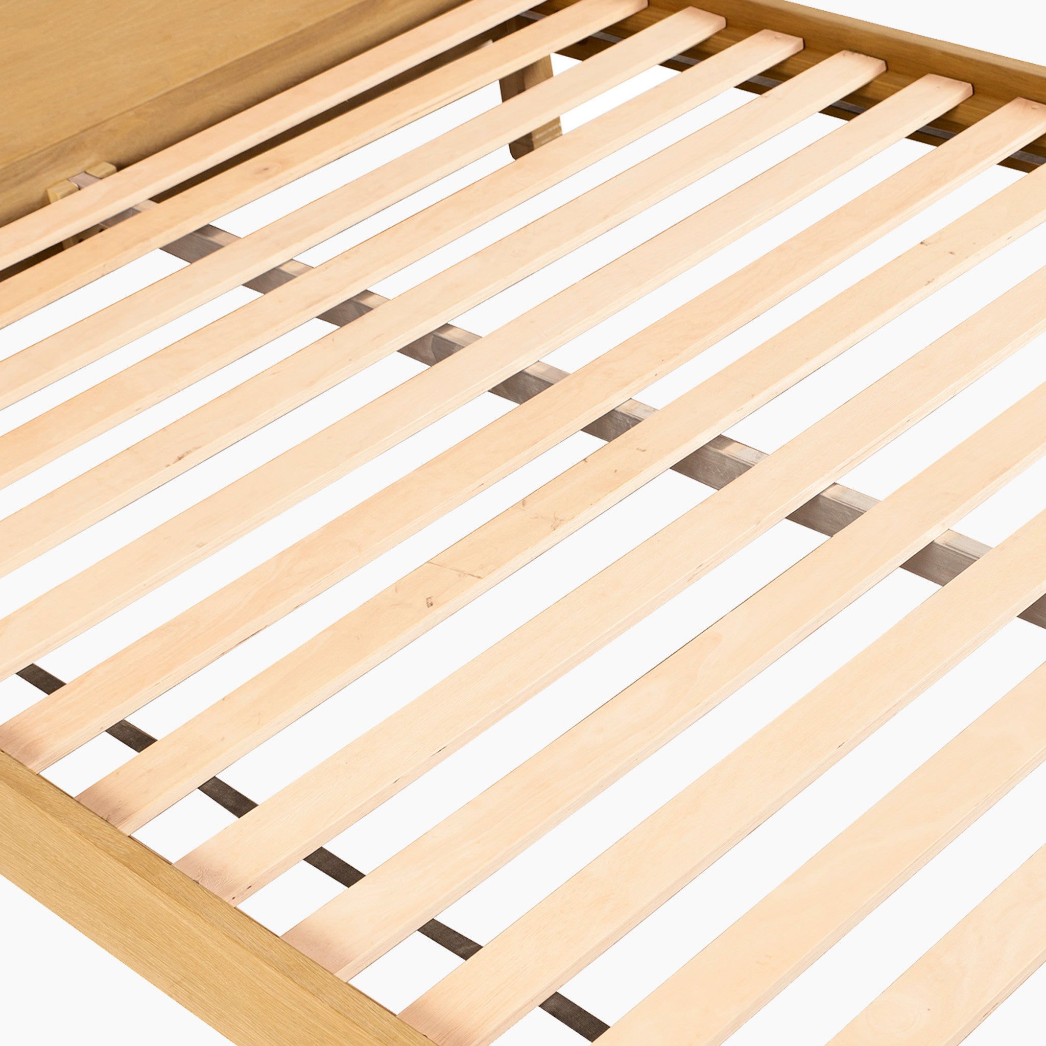 Close-up of the Amberley 5ft Kingsize Bed Frame in Light Oak, featuring solid oak construction, evenly spaced slats, and a simple corner headboard for an elegant high-end look.