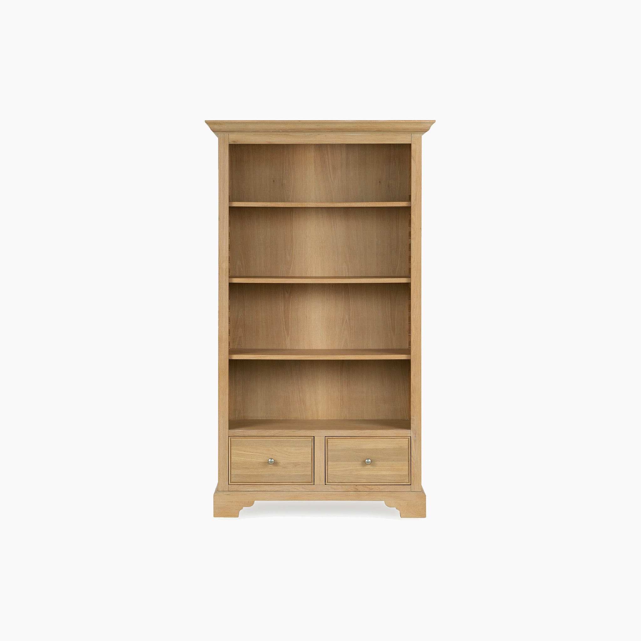 The Amberley Large Bookcase in Light Oak is a tall wooden bookcase with four shelves and two bottom drawers, ideal for modern country interiors, displayed against a white background.