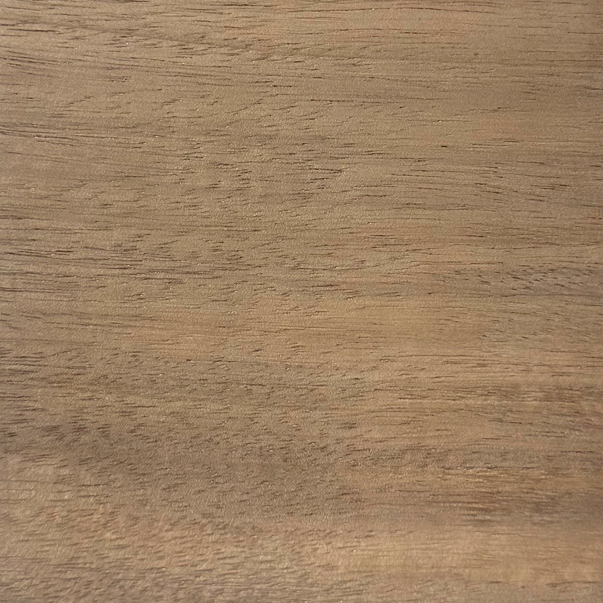 Close-up of the Acacia Swatch, featuring a smooth, light brown wooden surface with a natural grain pattern.