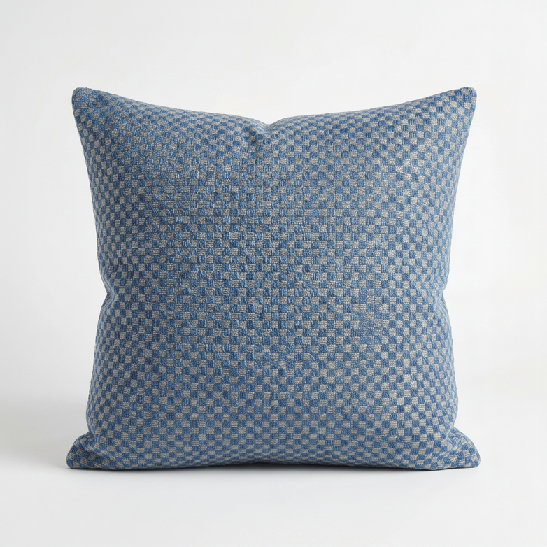 The Agora Senda Blue Medium Scatter Cushion (45cm x 45cm) features a subtle checkered pattern on solution-dyed acrylic, offering durable style for outdoor settings. Shown on a plain white background.