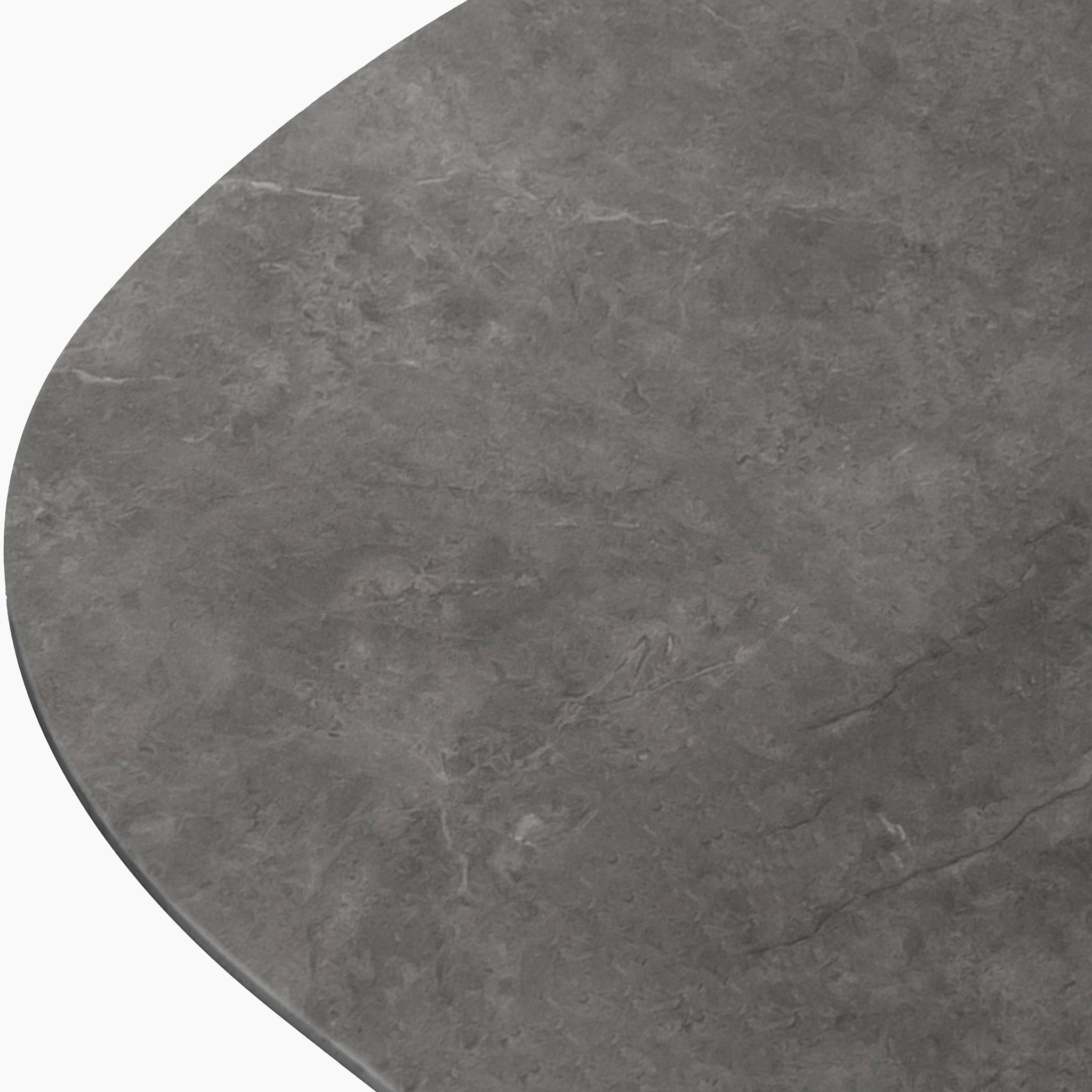 Close-up of a dark gray marble tabletop with subtle veining and rounded corners, ideal for pairing with outdoor dining furniture like the Kalama 8 Seat Oval Rope Dining Set with Albatross Extending Table in Truffle.