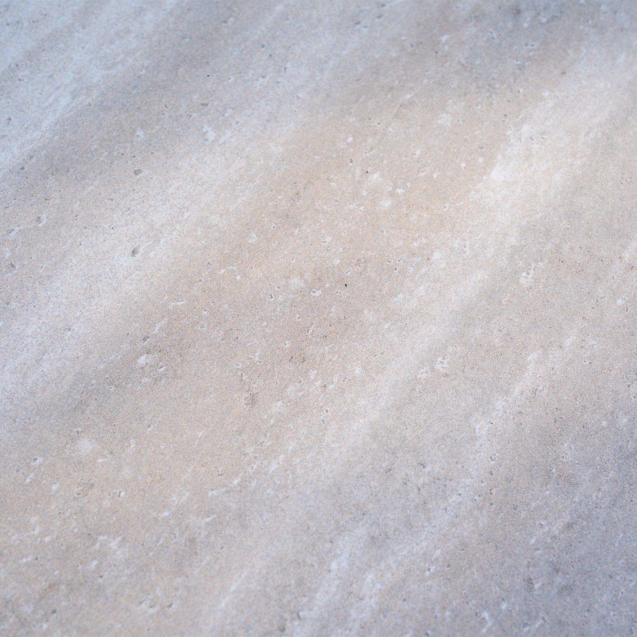 Close-up of a light gray stone surface with natural patterns and textures, ideal for pairing with garden furniture like the Alva Corner Dining Set with Rising Table in Fawn (Right Hand).