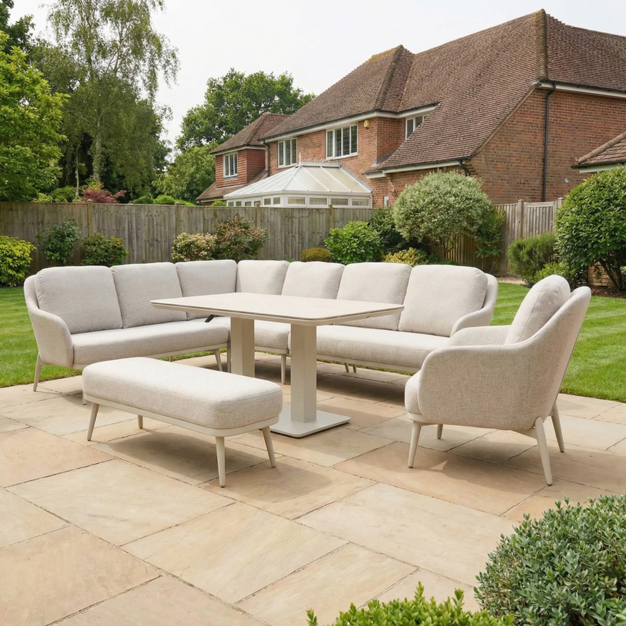 The Alva Corner Dining Set with Rising Table and Armchair in Fawn features an L-shaped sofa, bench, armchair, and adjustable table—stylish and versatile garden furniture perfect for any outdoor space.