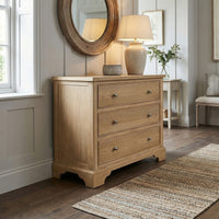 The Amberley 3 Chest of Drawers in Light Oak is perfect for stylish bedroom storage, featuring three drawers and a modern look—ideal for bright, cozy rooms with wood floors.