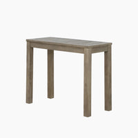 The Andora Narrow Side Table in Weathered Brown features a simple rectangular design with four legs, crafted from solid eucalyptus wood, and is shown against a plain white background.
