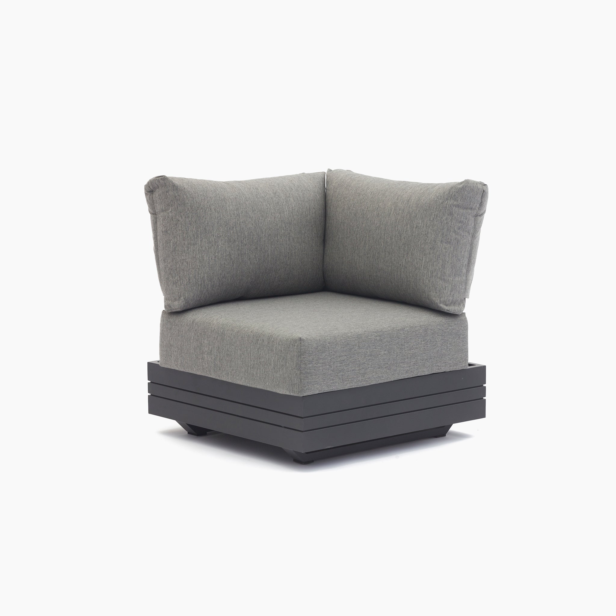 A contemporary Panama Corner Unit/Footstool in Washed Grey, featuring a square base and thick, padded cushions, set against a white background.