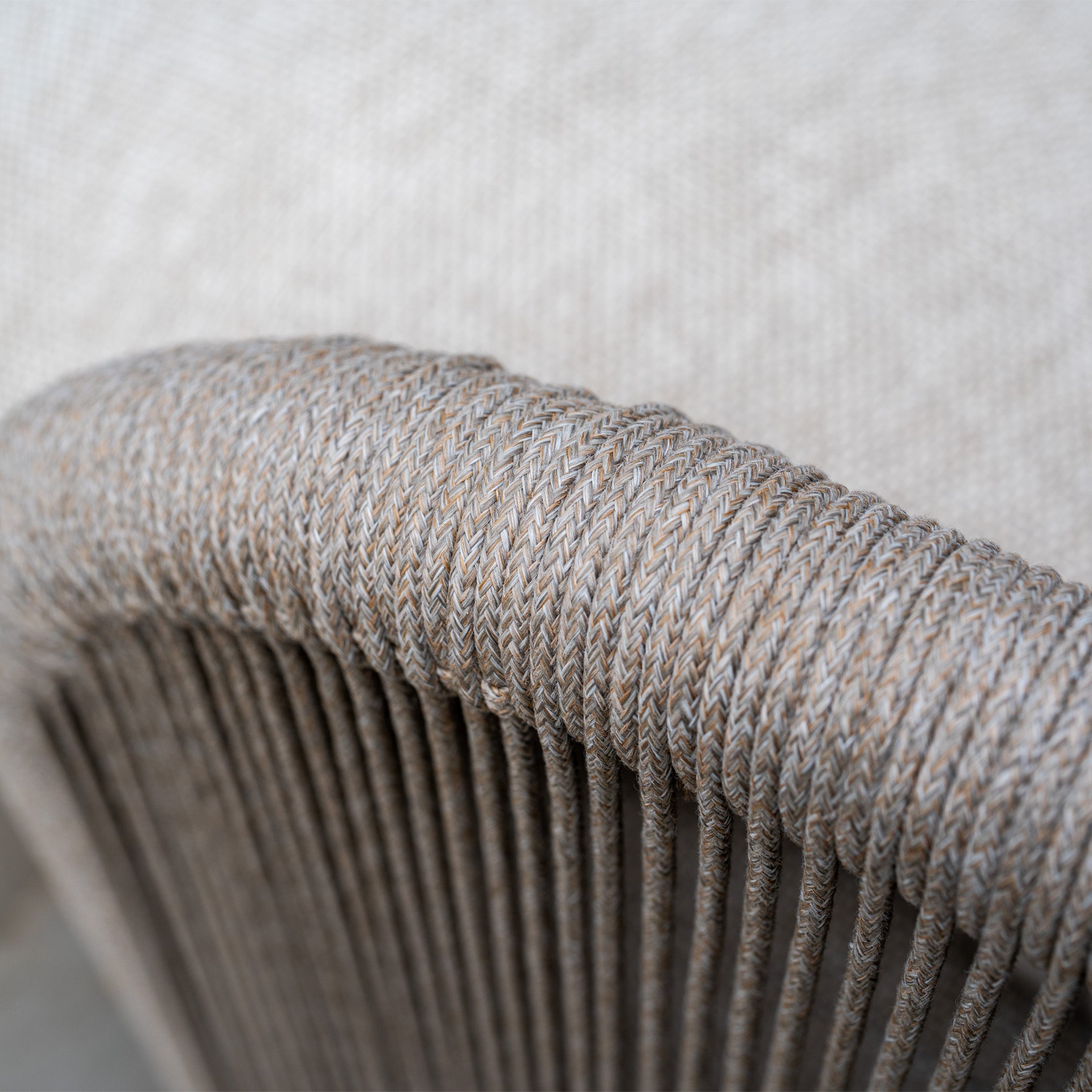 Close-up of woven rope texture in earthy tones on a chair, crafted with weather-resistant olefin—perfect for outdoor use or pairing with the Avola Corner Sofa Set in Fawn.