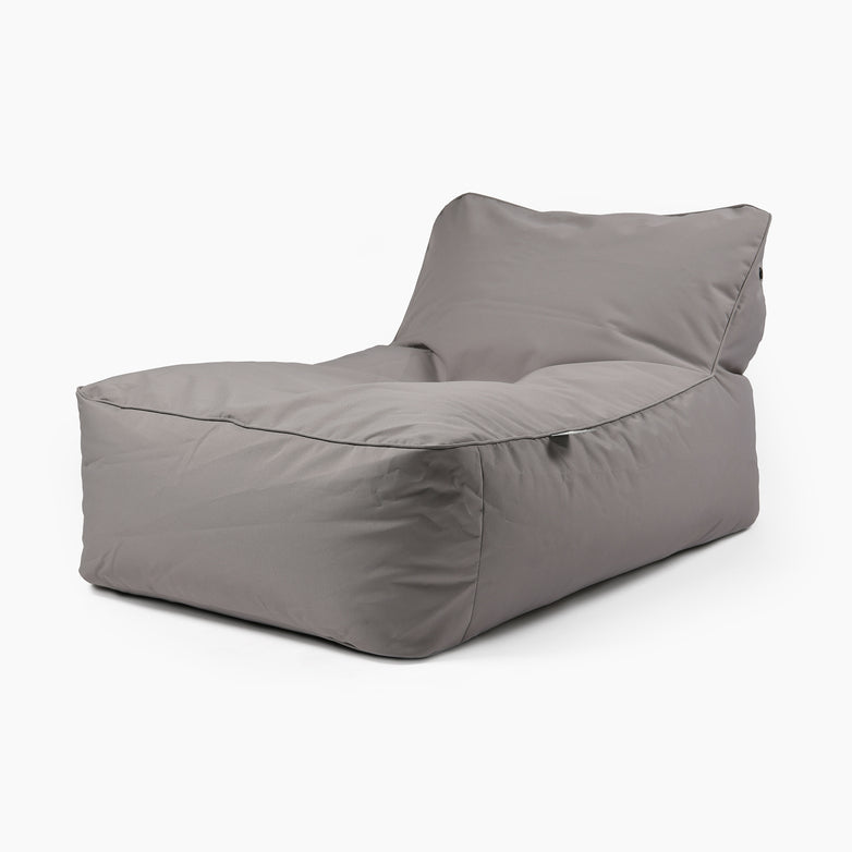 The Outdoor B-Bed in Silver Grey, a modern-style bean bag chair with a backrest and comfortable polybead filling, sits elegantly on a white background.