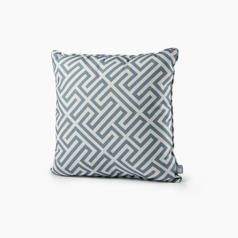 The Outdoor Maze B-Cushion in Sea Blue features a square design with a geometric, maze-like pattern in shades of sea blue and white. This splash-proof cushion adds a stylish touch to outdoor spaces while being UV resistant for lasting vibrancy. It perfectly complements B-bag cushions.