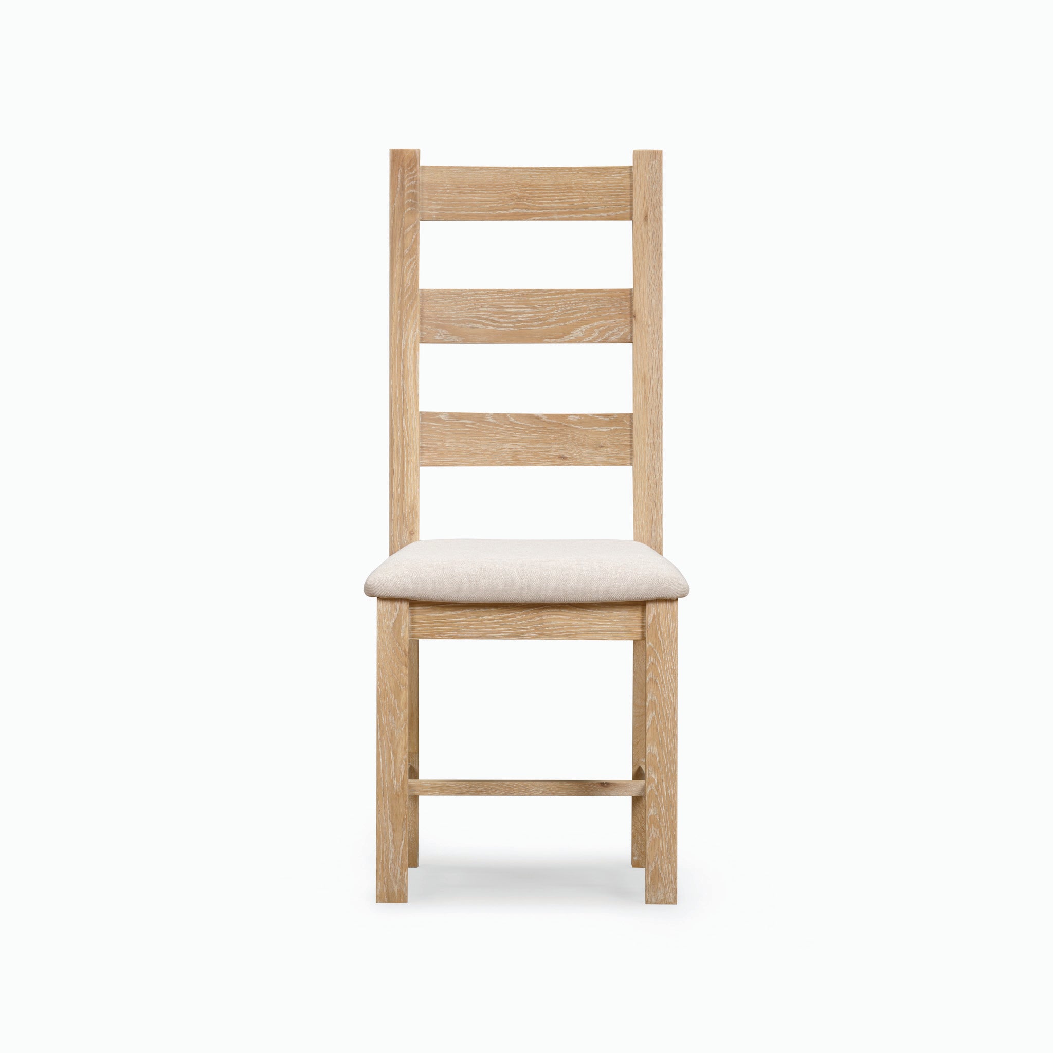 The Burford Set of 2 Ladderback Dining Chairs with Fabric Seat in Natural Oak boasts a natural oak frame combined with a light beige upholstered seat, offering a perfect blend of traditional charm and modern comfort.