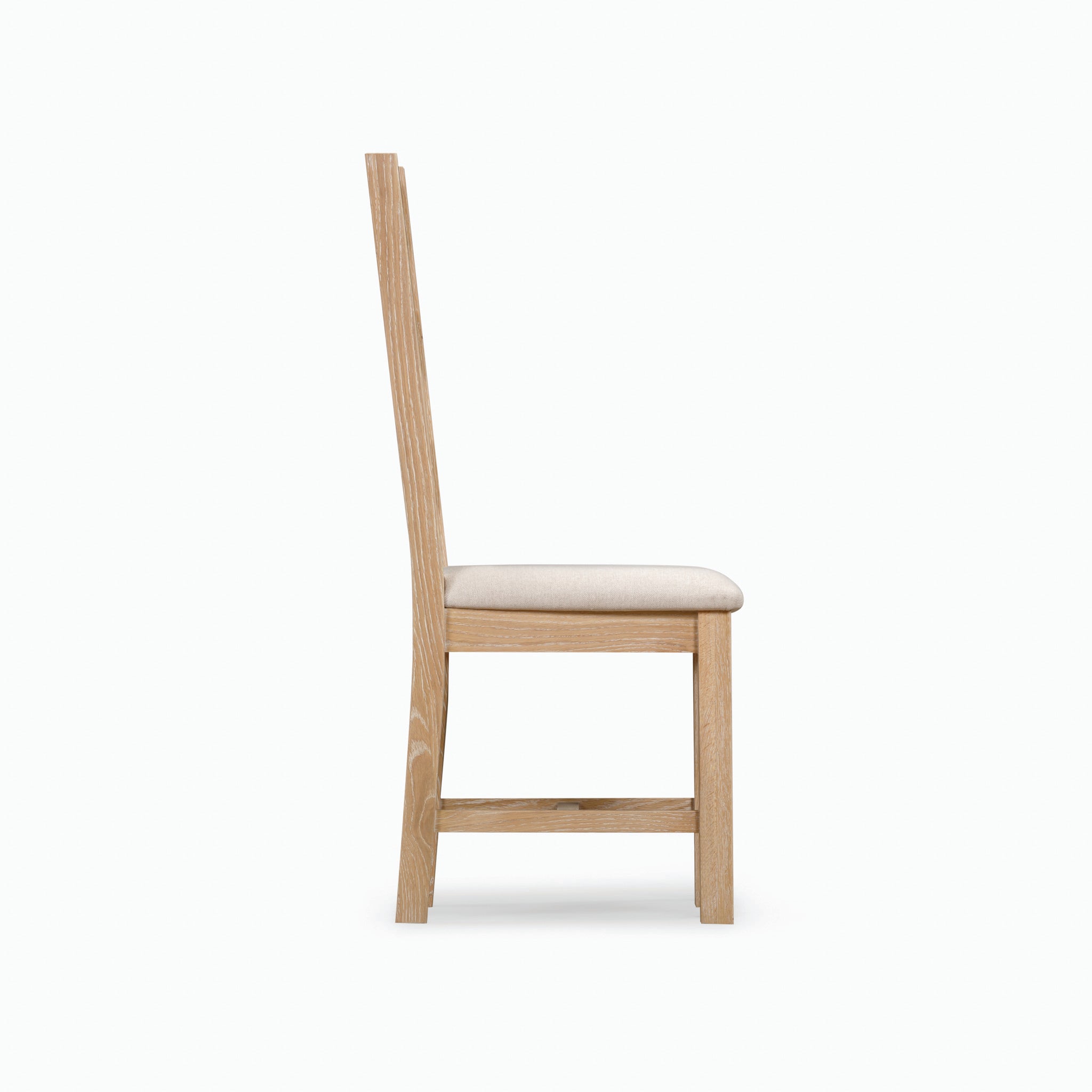 Side view of one chair from the Burford Set of 2 Ladderback Dining Chairs, featuring a beige upholstered fabric seat and crafted from natural oak, set against a light background.