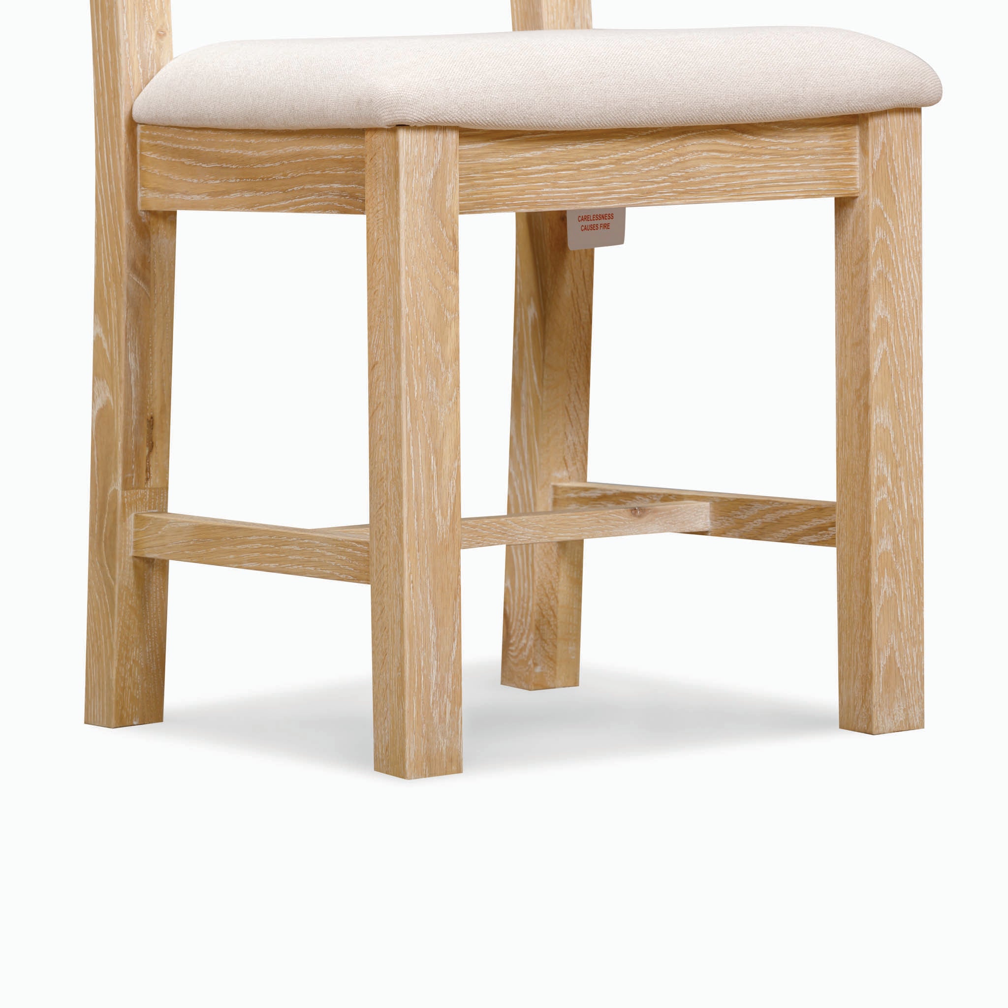 The Burford Set of 2 Ladderback Dining Chairs boasts a natural oak frame and a fabric seat in beige, displayed against a plain background.