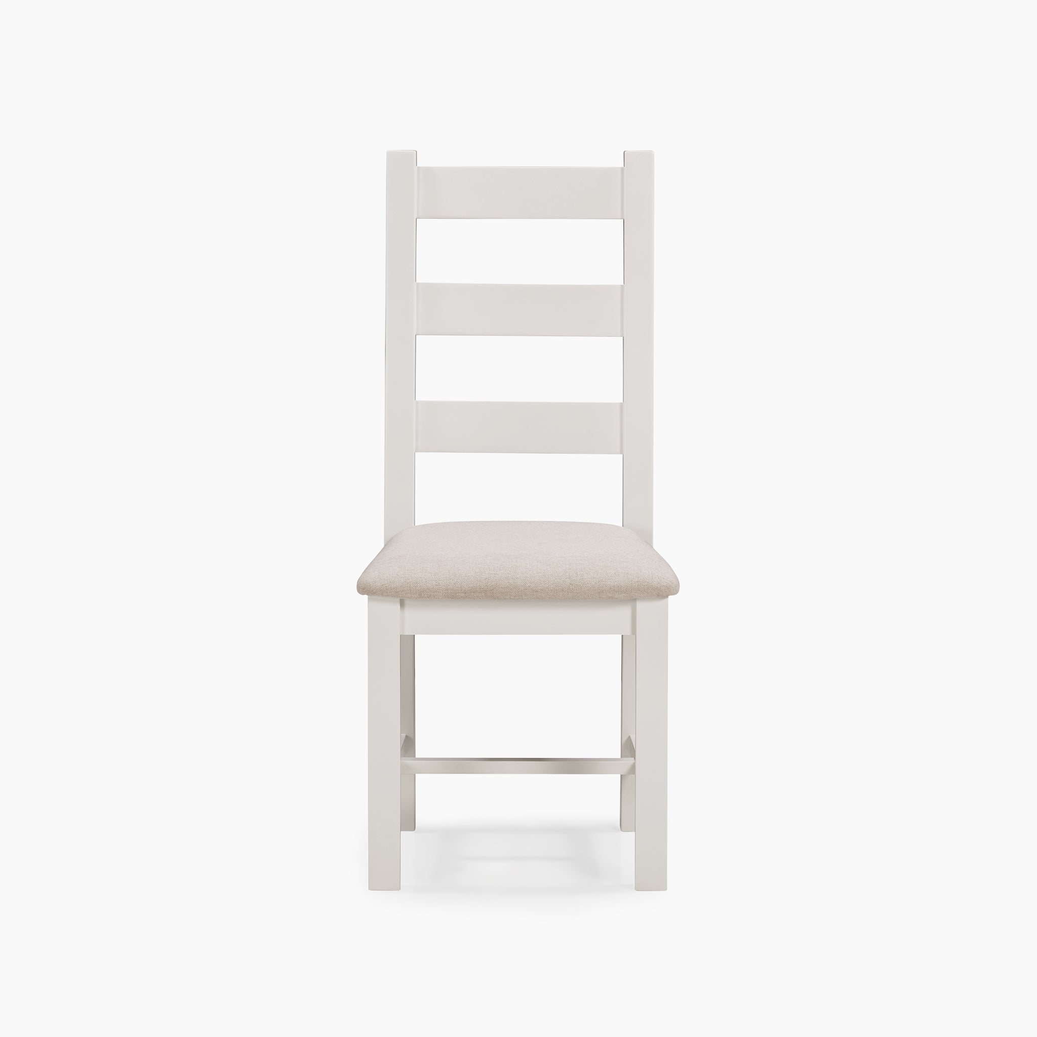 The Burford 6 Seat Extending Dining Set in Warm White showcases a white wooden chair with a beige cushioned seat, elegantly displayed on a plain white background in front view, perfectly complementing the extending dining table as an essential piece of the stylish set.