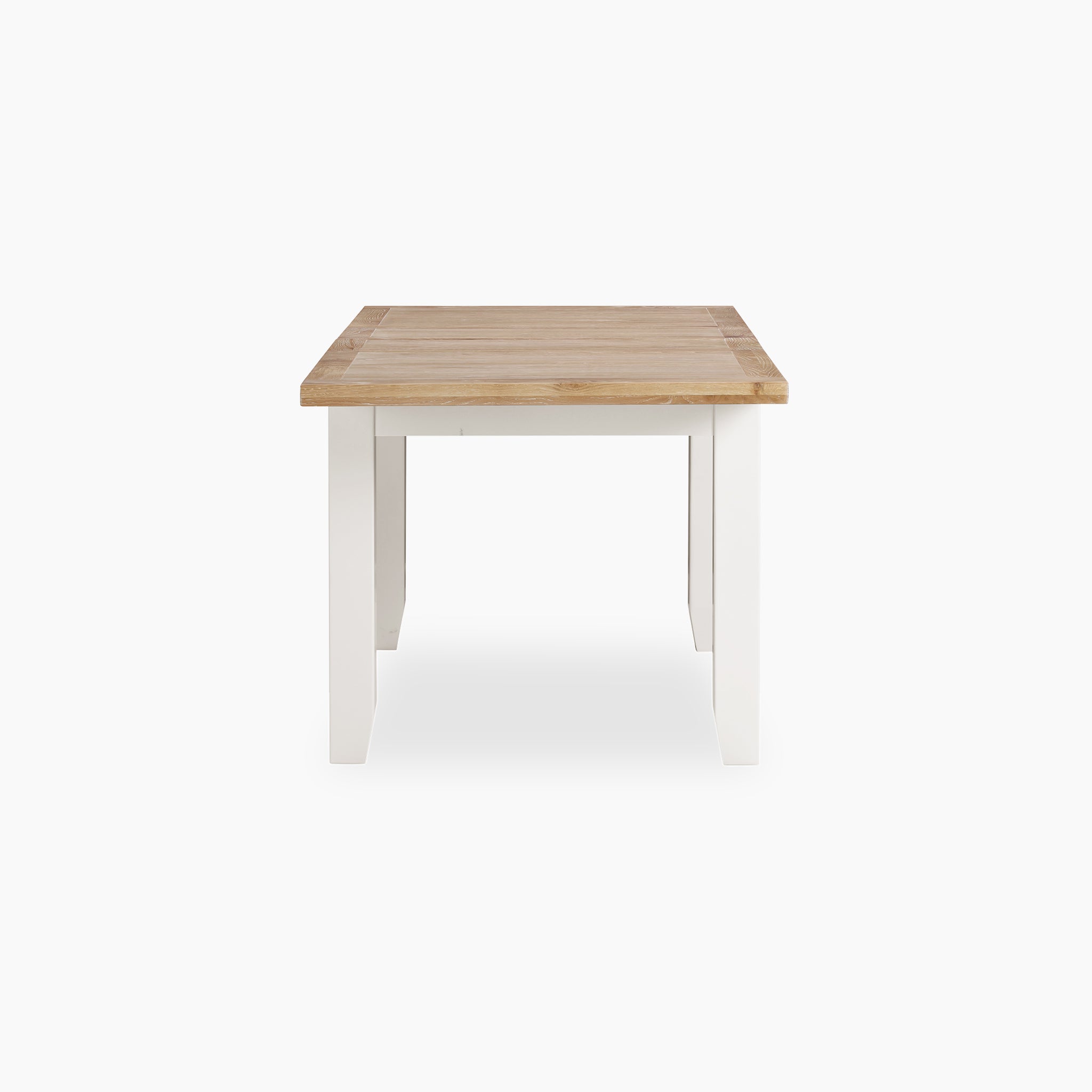 This Burford 6 Seat Extending Dining Set in Warm White showcases a wooden rectangular table with warm white legs and a natural wood top, as seen from the front.