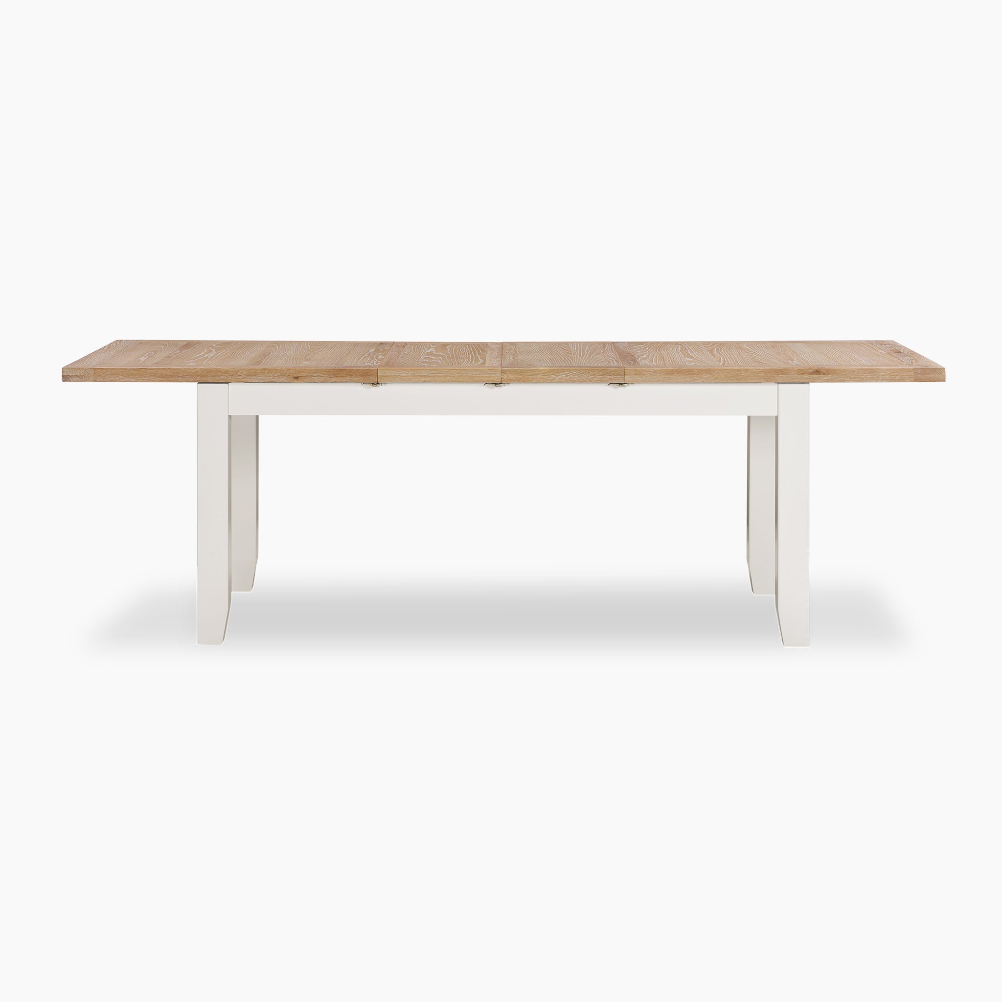The Burford 8 Seat Extending Dining Set in Warm White showcases a natural oak top paired with elegant white legs, beautifully displayed against a plain white background.