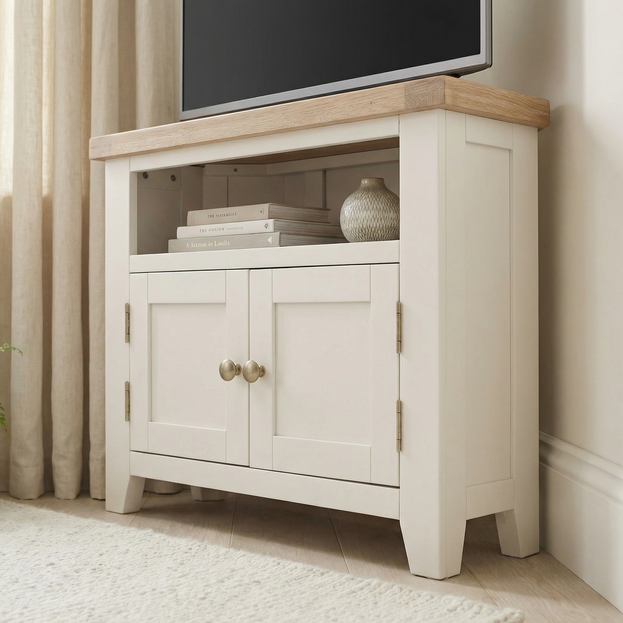 Burford Corner Media Unit in Warm White with a wooden top, two doors, and an open shelf—ideal for media storage and stylish cable management.