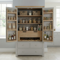 Open pantry with jars, bottles, baskets, and food packages neatly arranged on shelves and in drawers—ideal for the Burford Double Larder Unit in Pebble Grey to maximize and organize your kitchen storage.