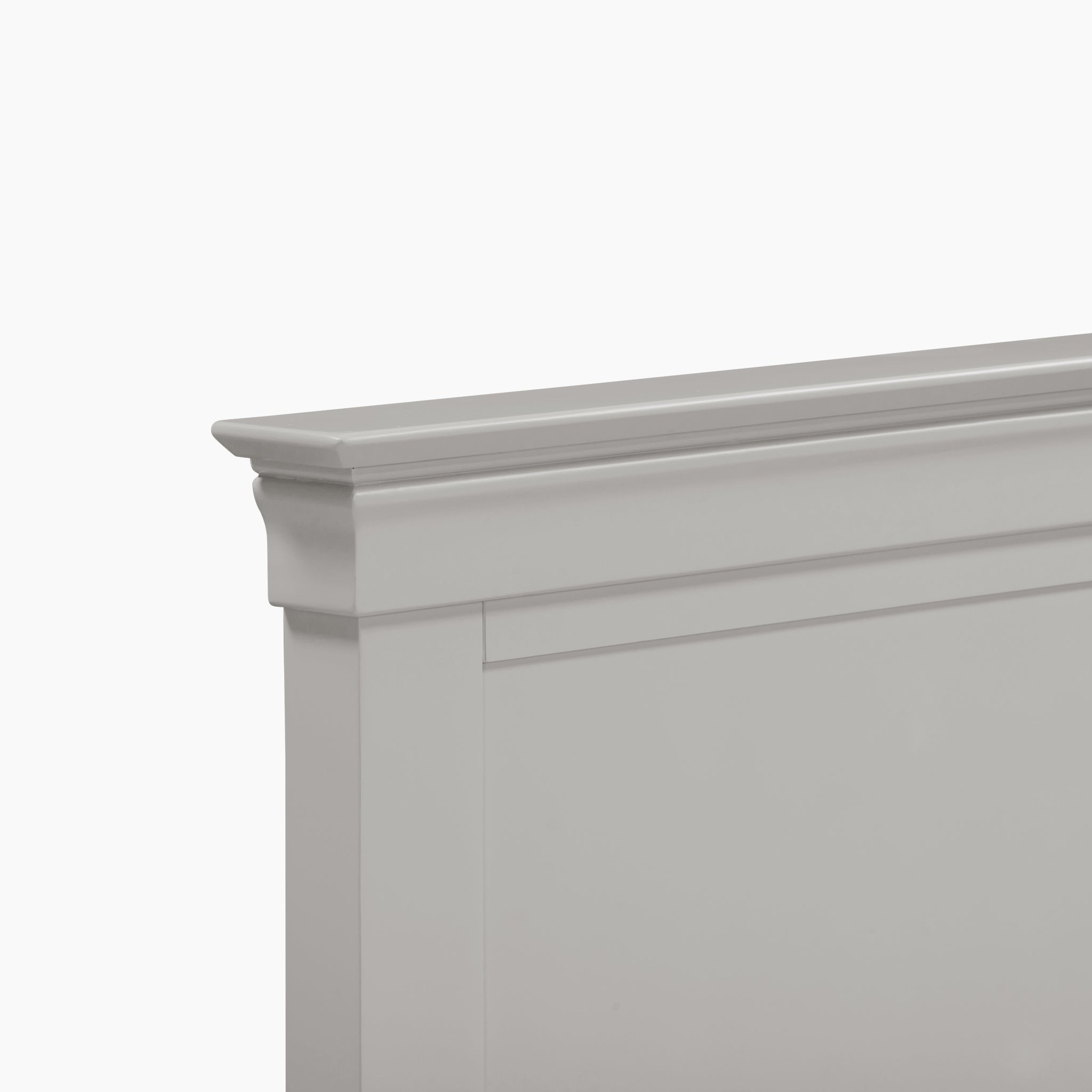 Close-up of the Pebble Grey Chalbury 3ft High-End Single Bed Frame's decorative headboard corner, featuring ornate molding detail.