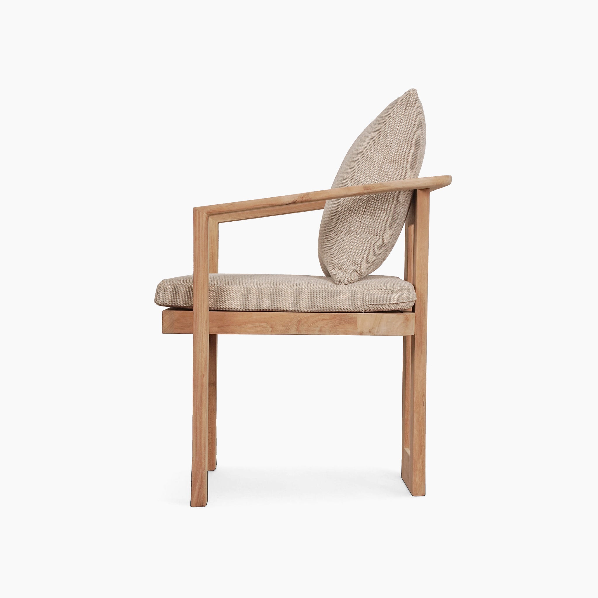 Side view of a teak wood chair with beige seat and backrest cushions, perfectly complementing the Tivoli 6 Seat Dining Set featuring a Marble Dining Table in Fawn against a white background.