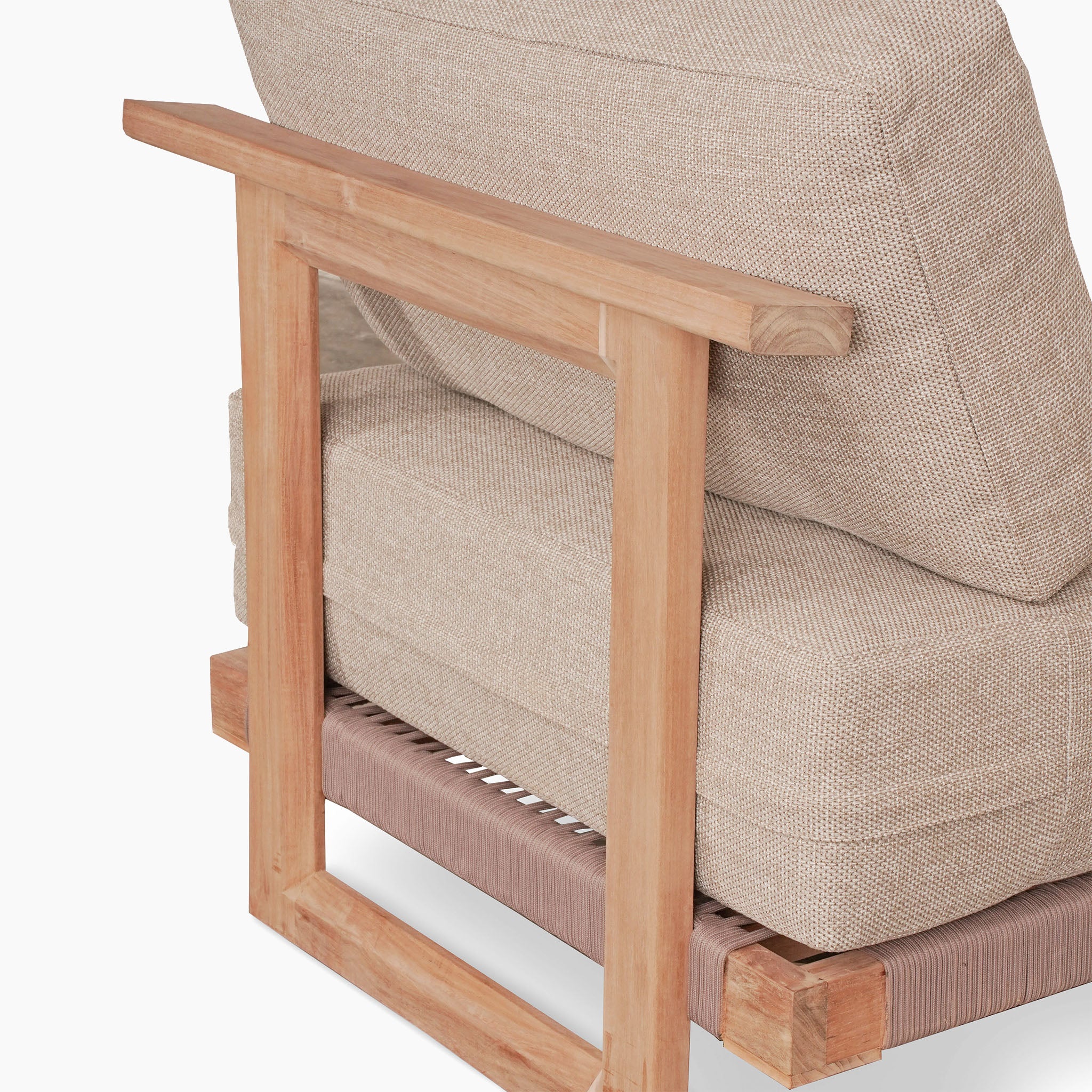Back view of the Tivoli Large Corner Set, featuring a cushioned chair with a teak wood frame, upholstered in beige fabric and paired with a marble coffee table.