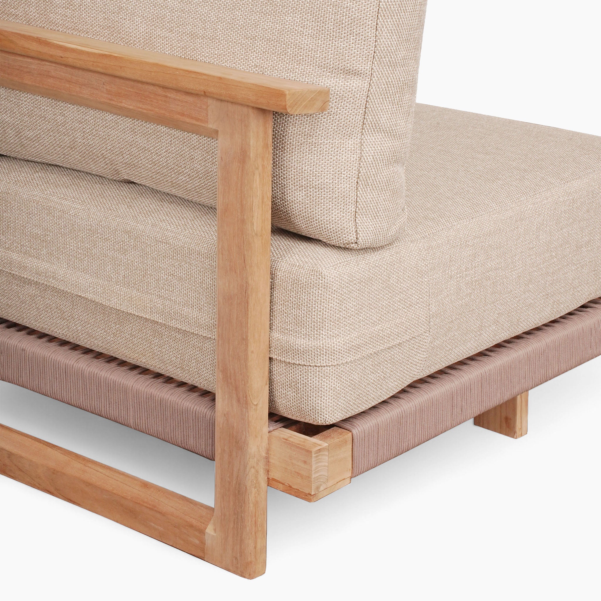 The Tivoli Large Corner Set features a cushioned fawn design with a sleek Teak frame and woven base, alongside a marble coffee table, showcasing minimalist craftsmanship.