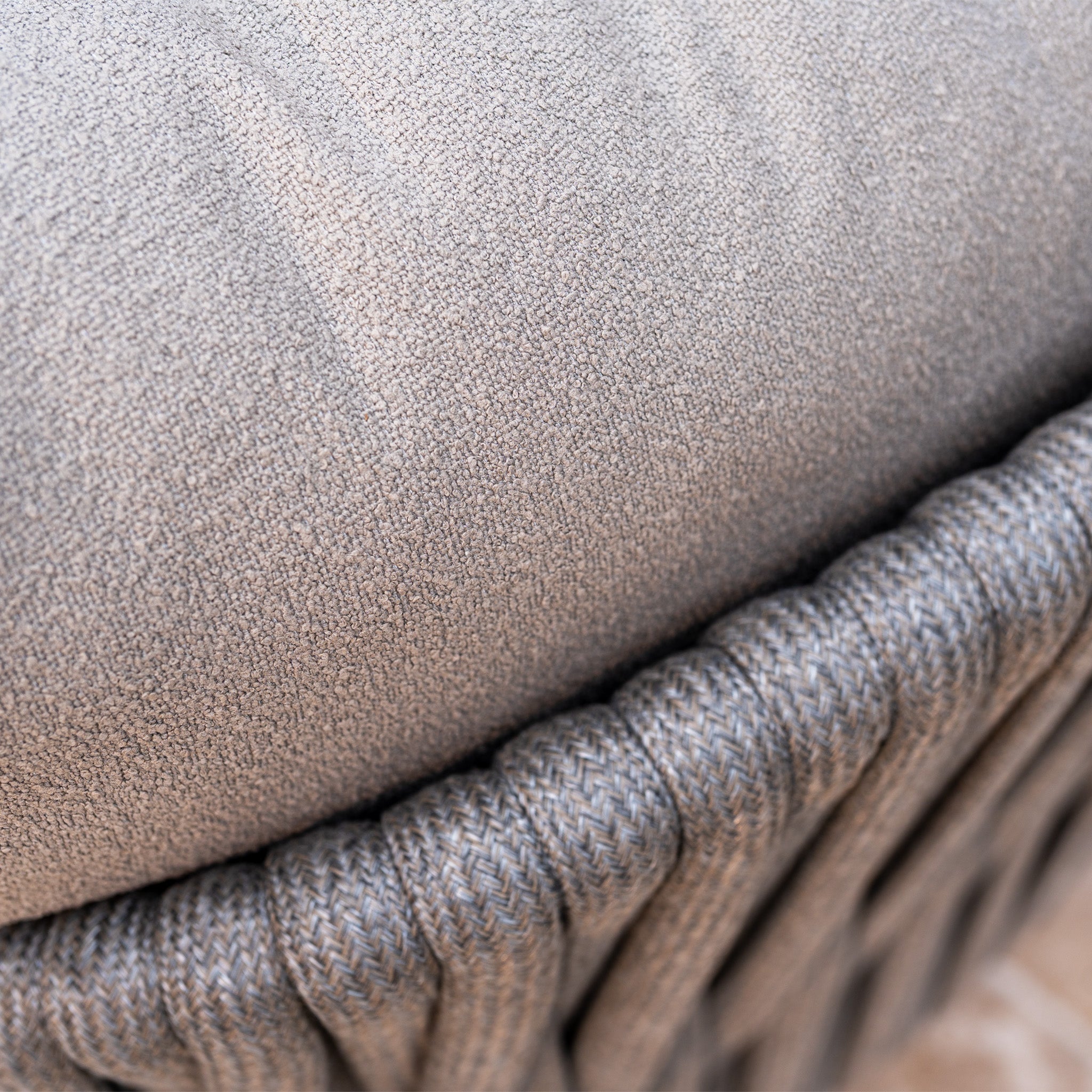 Close-up of a gray textured cushion on the Capri 3 Seat Sofa Set in Stone Grey, showcasing detailed fabric and woven patterns—an elegant choice for any outdoor sofa set or garden furniture collection.