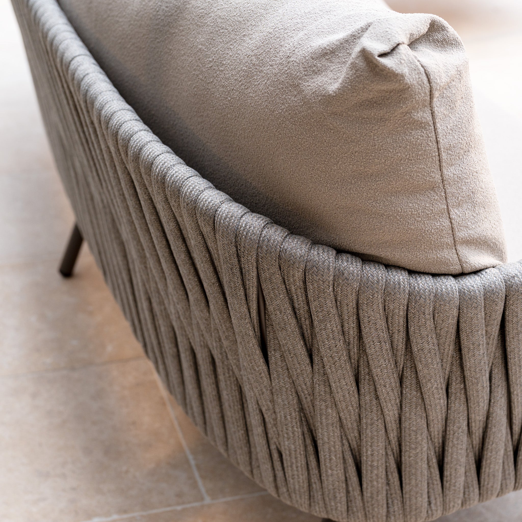 Close-up of the Capri 3 Seat Sofa Set in Stone Grey featuring textured woven fabric and plush back cushions—an elegant upgrade for any outdoor space.
