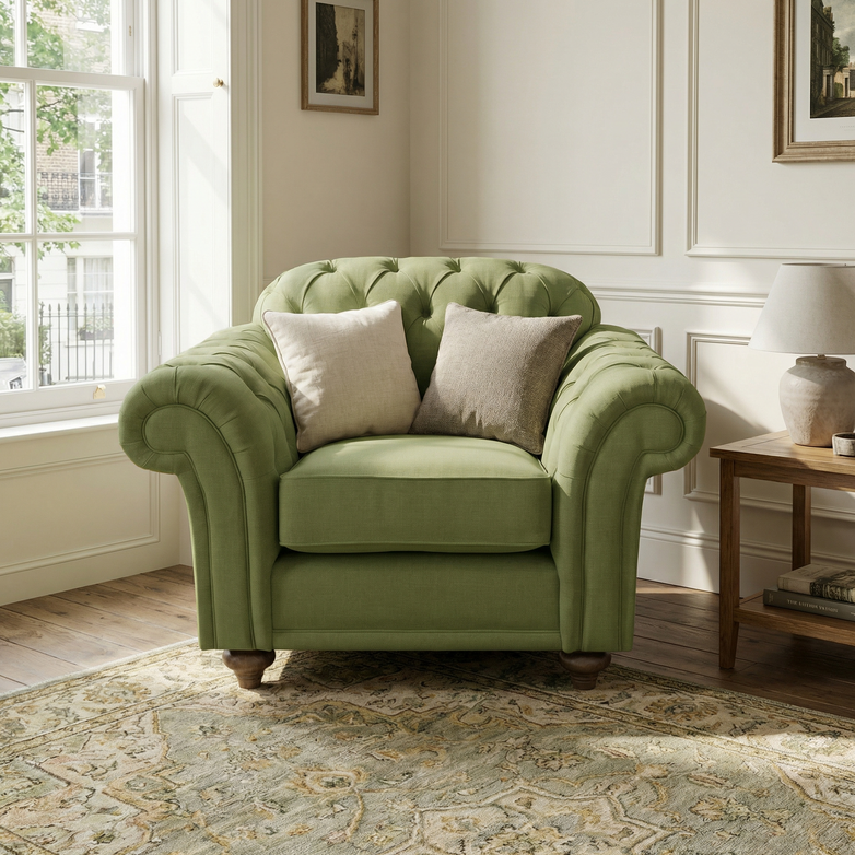 A Chesterfield Armchair in Olive, handcrafted in England with two cushions, sits in a sunlit living room, bringing classic British style to the cozy decor.