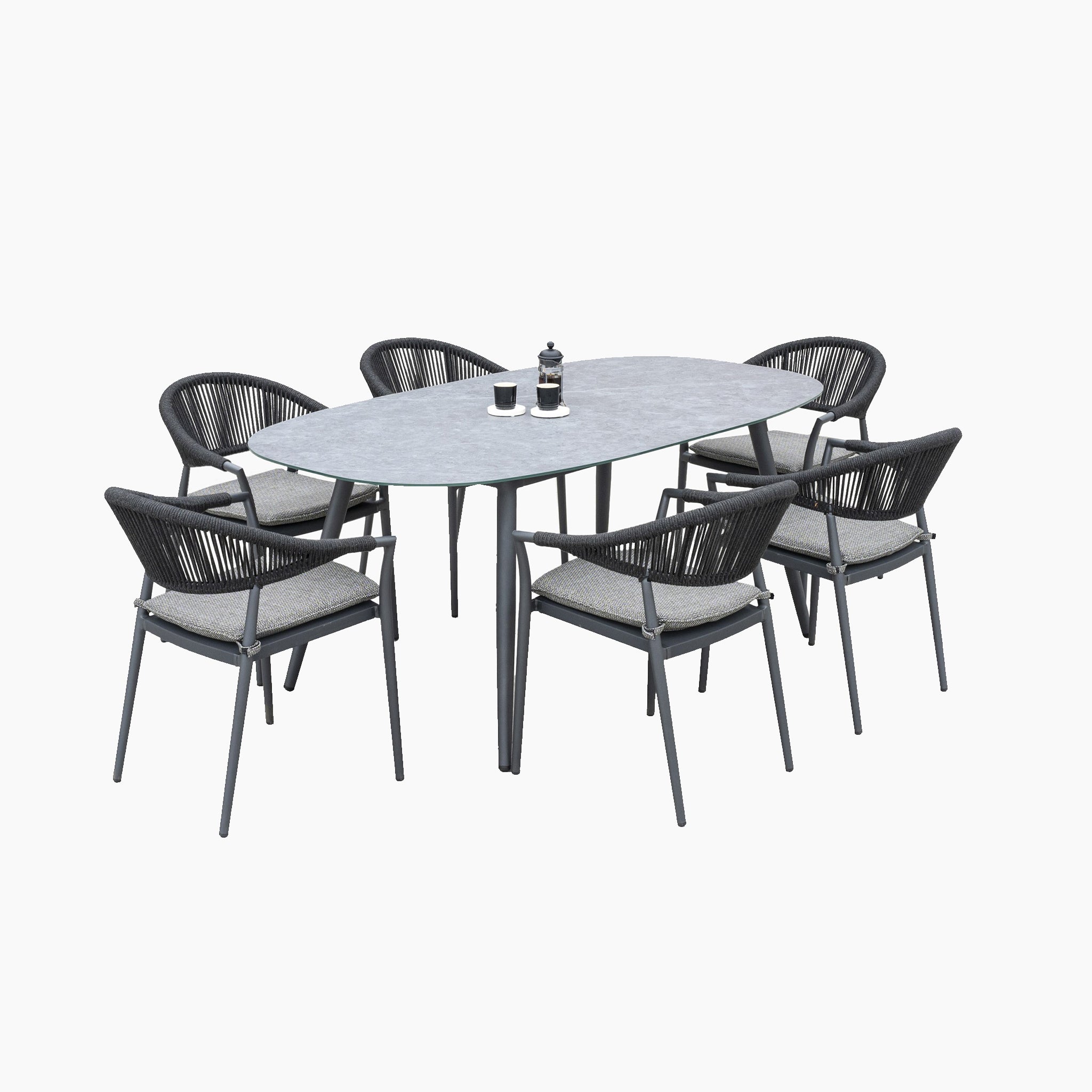 The Cloverly 6 Seat Rope Oval Dining Set with a Ceramic Table in Charcoal features a sleek ceramic table surrounded by six comfortable woven chairs, perfect for outdoor dining.