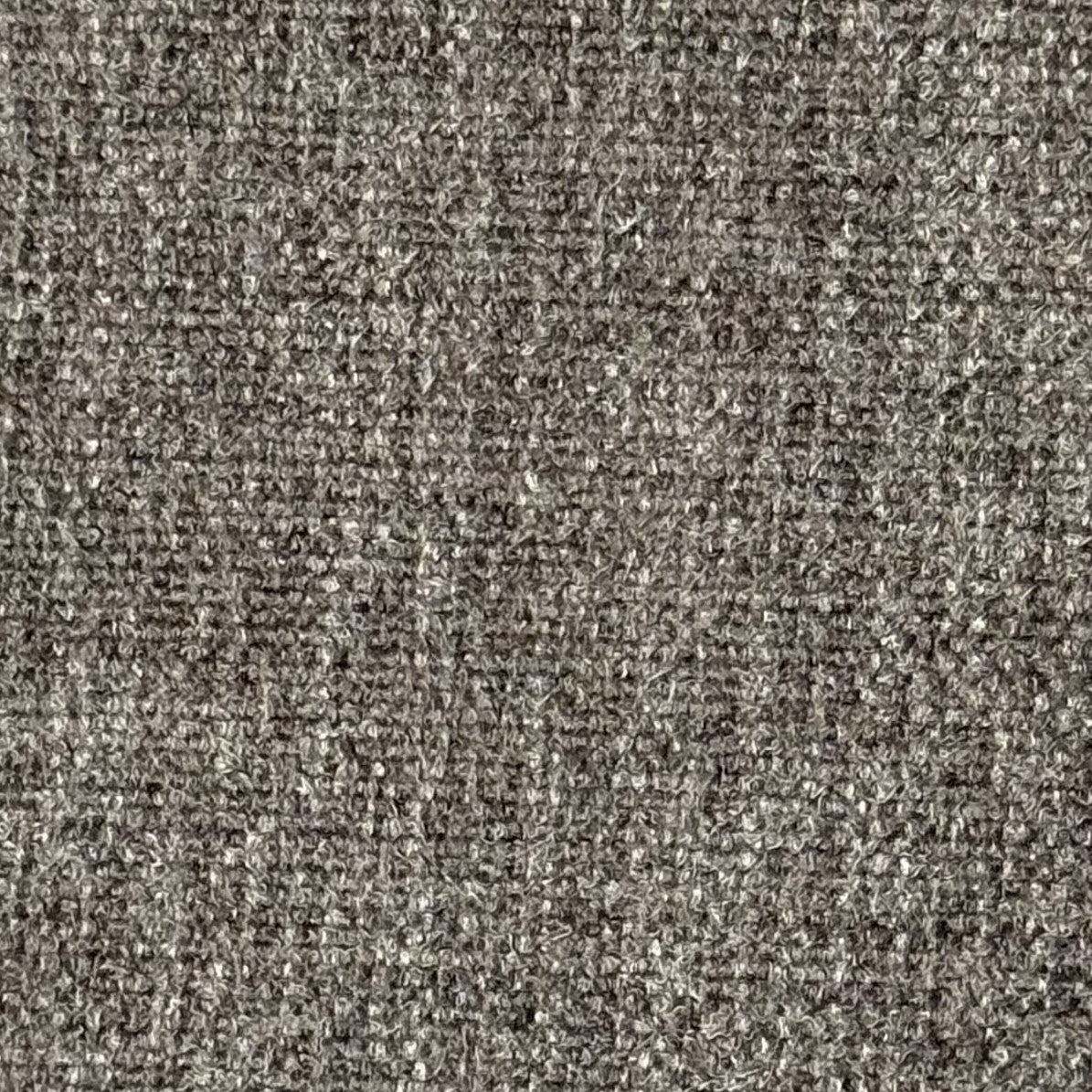 Close-up of Cocoa Fabric showing its textured gray surface with a tightly woven, looped pattern.