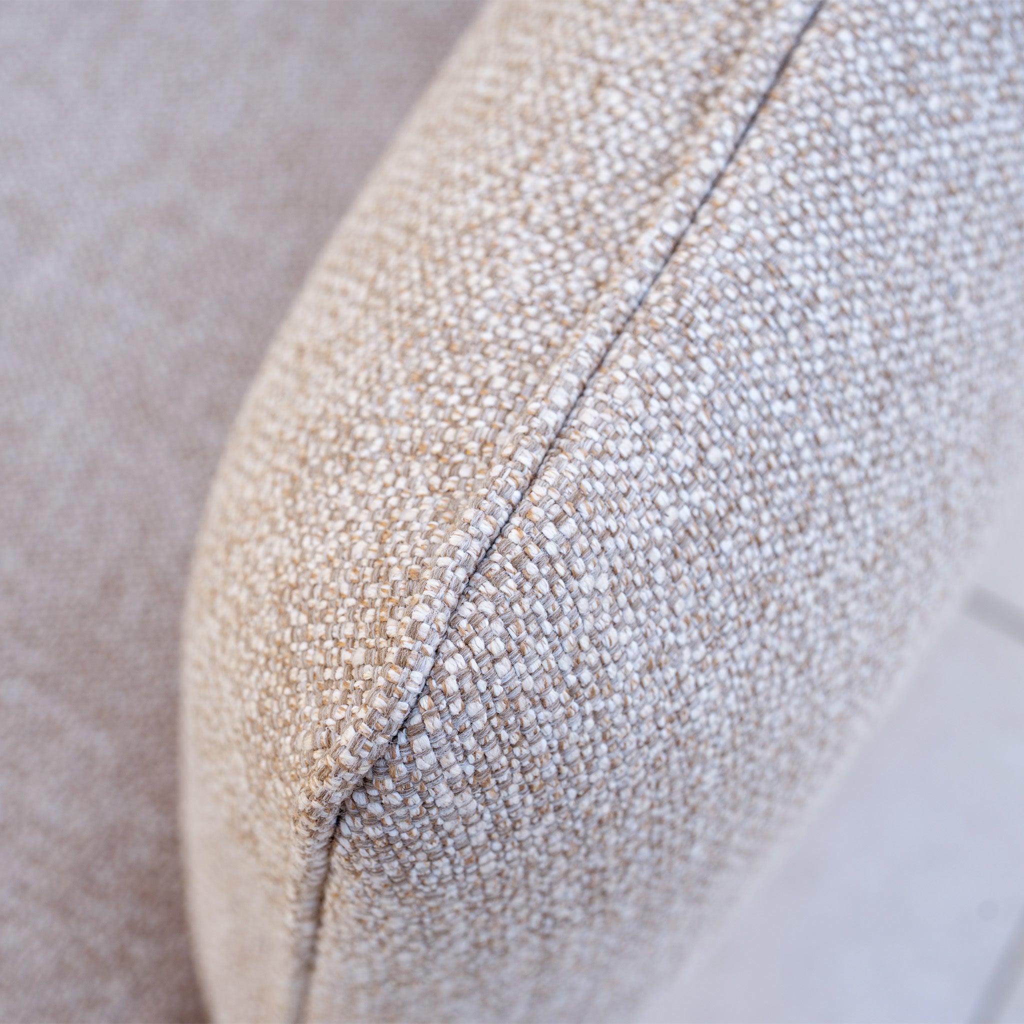 Close-up of a textured oatmeal fabric arm from the Como Corner Sofa Set with Altura Rising Table, highlighting the visible seam stitching.