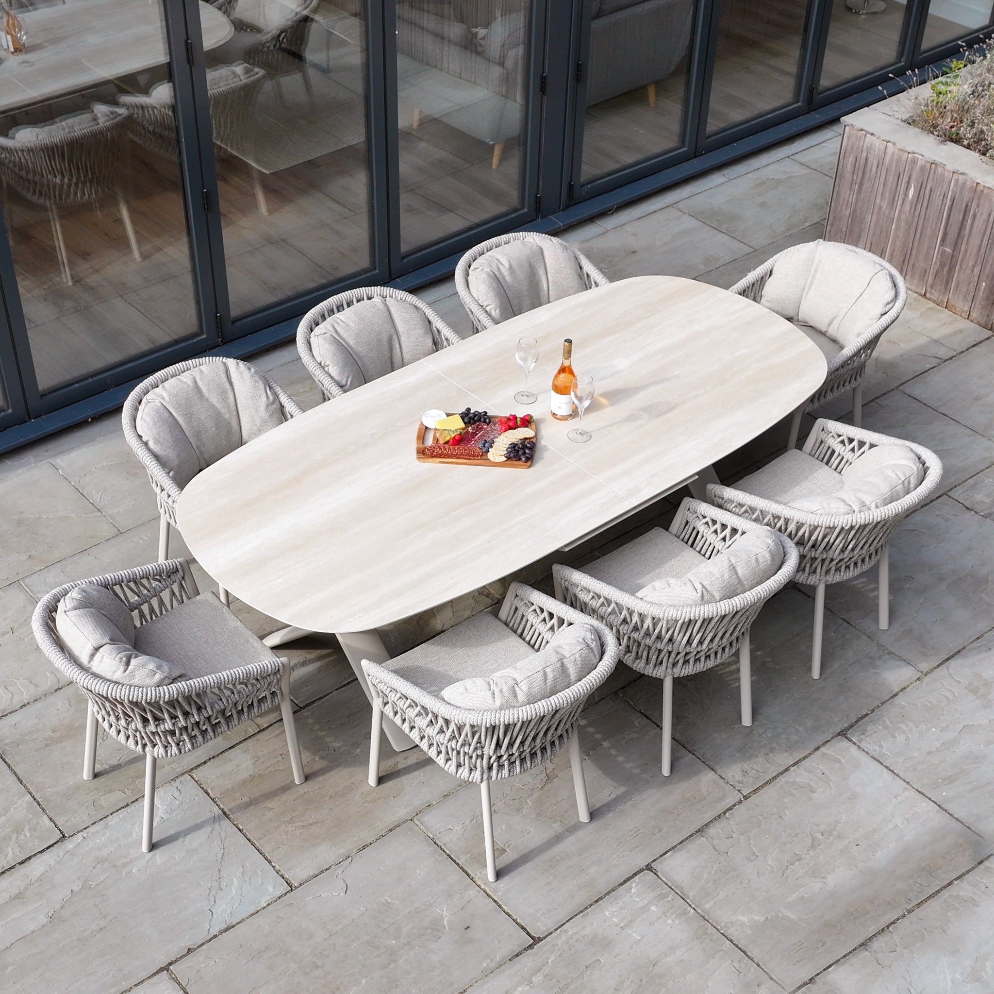 The Pello 8 Seat Oval Dining Set with Albatross Extending Table in Fawn is a durable garden set with eight cushioned chairs, perfect for outdoor gatherings on a stylish patio. Built for lasting comfort and ideal for entertaining.